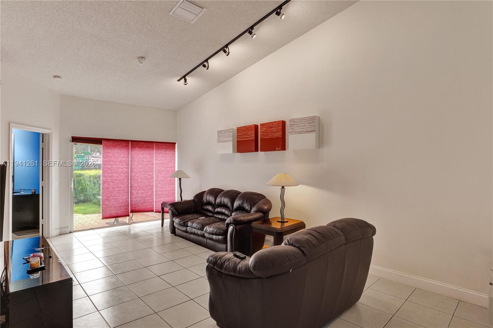 1851 Southwest 116th Way Miramar, FL 33025 - Photo 10 of 30 a living room with furniture