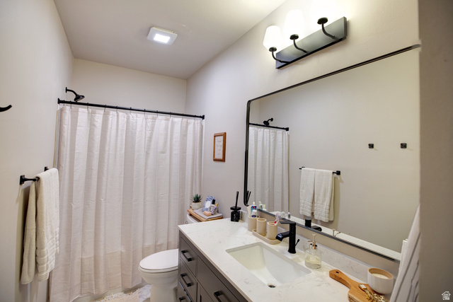983 South 950 West Provo, UT 84601 - Photo 33 of 56 Contemporary bathroom featuring a dark wood-finish vanity with a white countertop and rectangular undermount sink