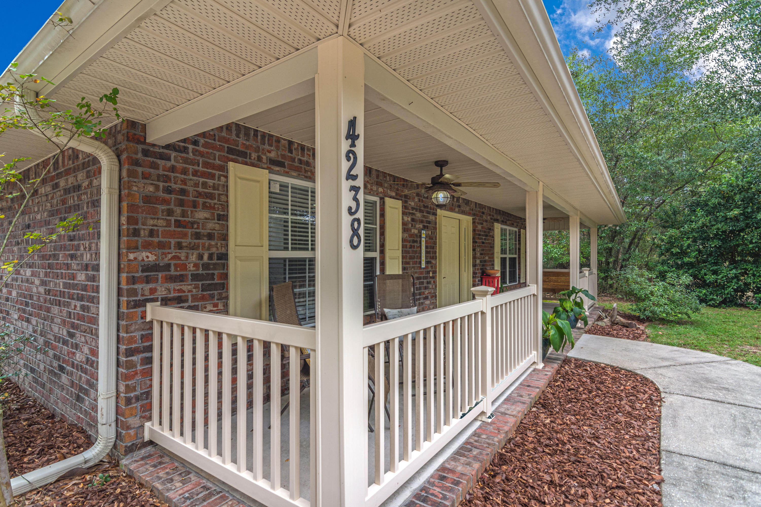 4238 Painter Branch Road Crestview, FL 32539 - Photo 3 of 30 a view of a house with a small yard and wooden floor and fence