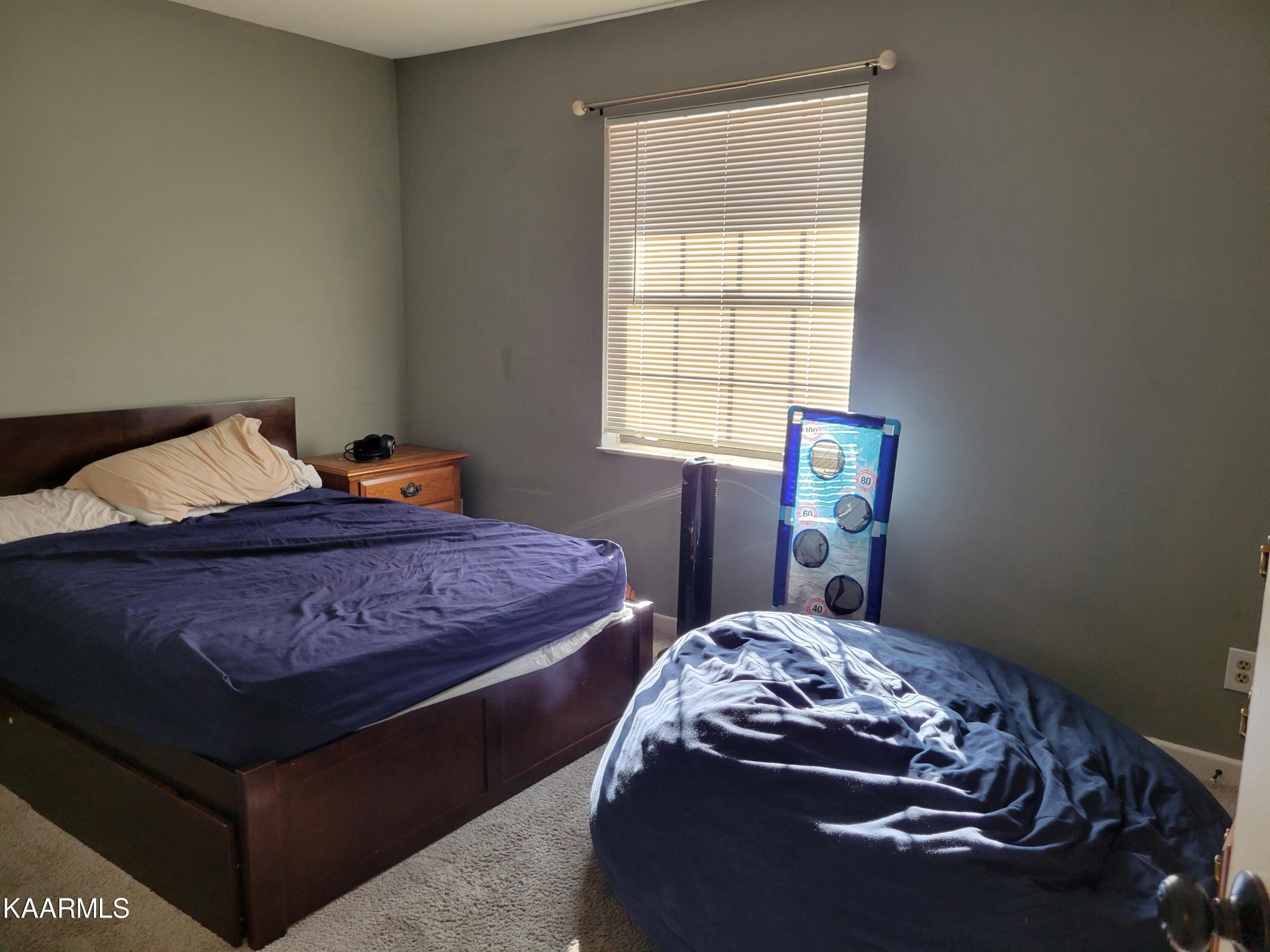 882 Proffitt Springs Road Maryville, TN 37801 - Photo 3 of 16 a bedroom with a bed and a window