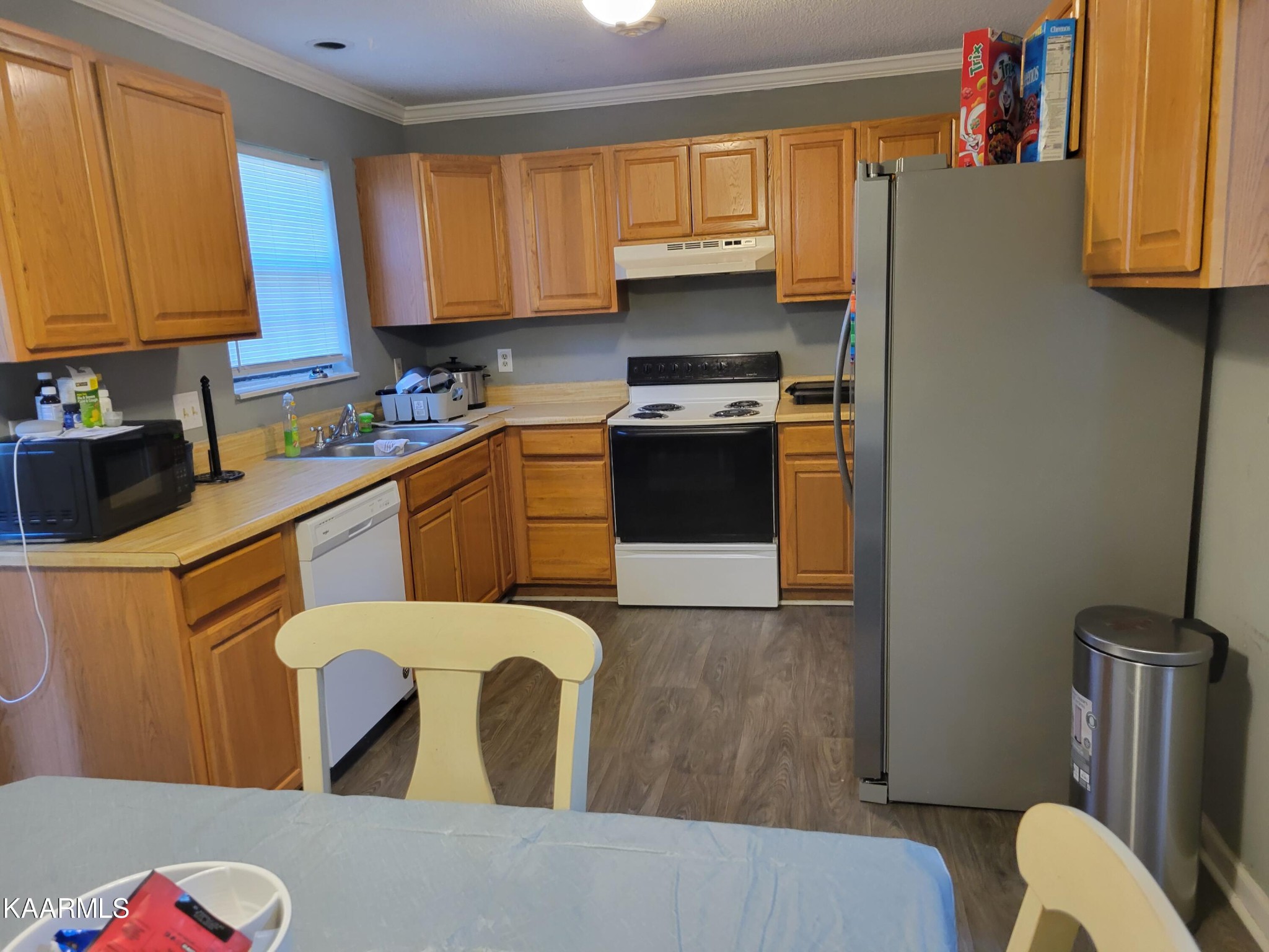 882 Proffitt Springs Road Maryville, TN 37801 - Photo 5 of 16 a kitchen with stainless steel appliances a refrigerator a sink a stove top oven a counter space and cabinets