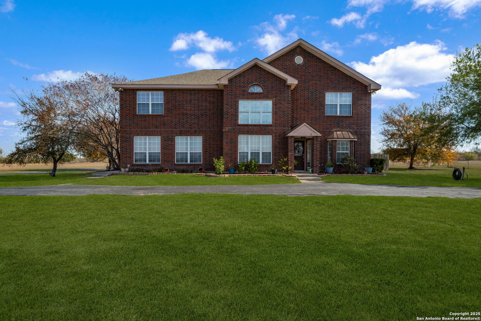 a front view of building with yard
