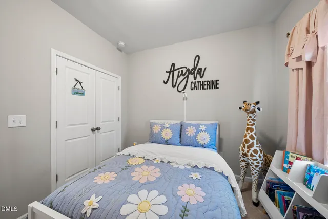 a bedroom with a bed and a book shelf