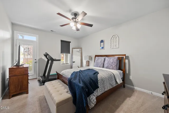 a bed room with a bed and a window