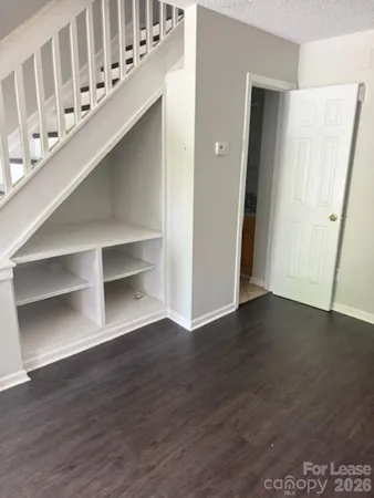 a view of an entryway with wooden floor