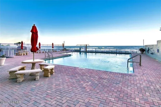 a view of a swimming pool with a patio