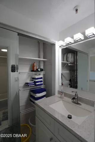 a bathroom with a sink and a mirror