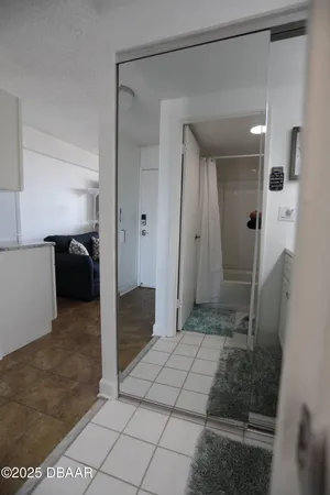 a bathroom with a shower and a sink