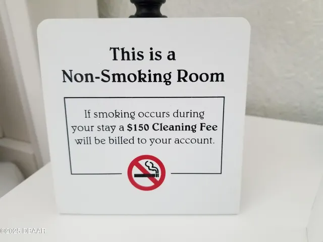 a view of a table and chairs under an umbrella