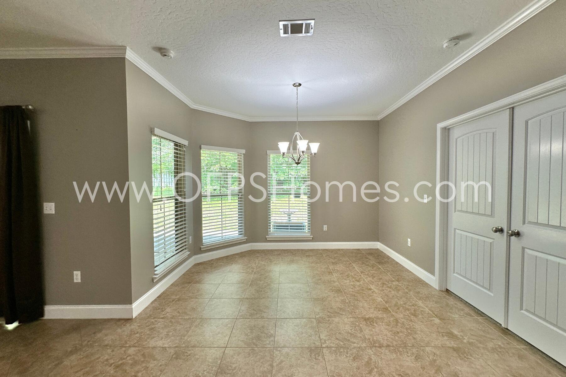 4542 Annabelle Lane Crestview, FL 32539 - Photo 14 of 35 a view of a hallway with an empty room and a window