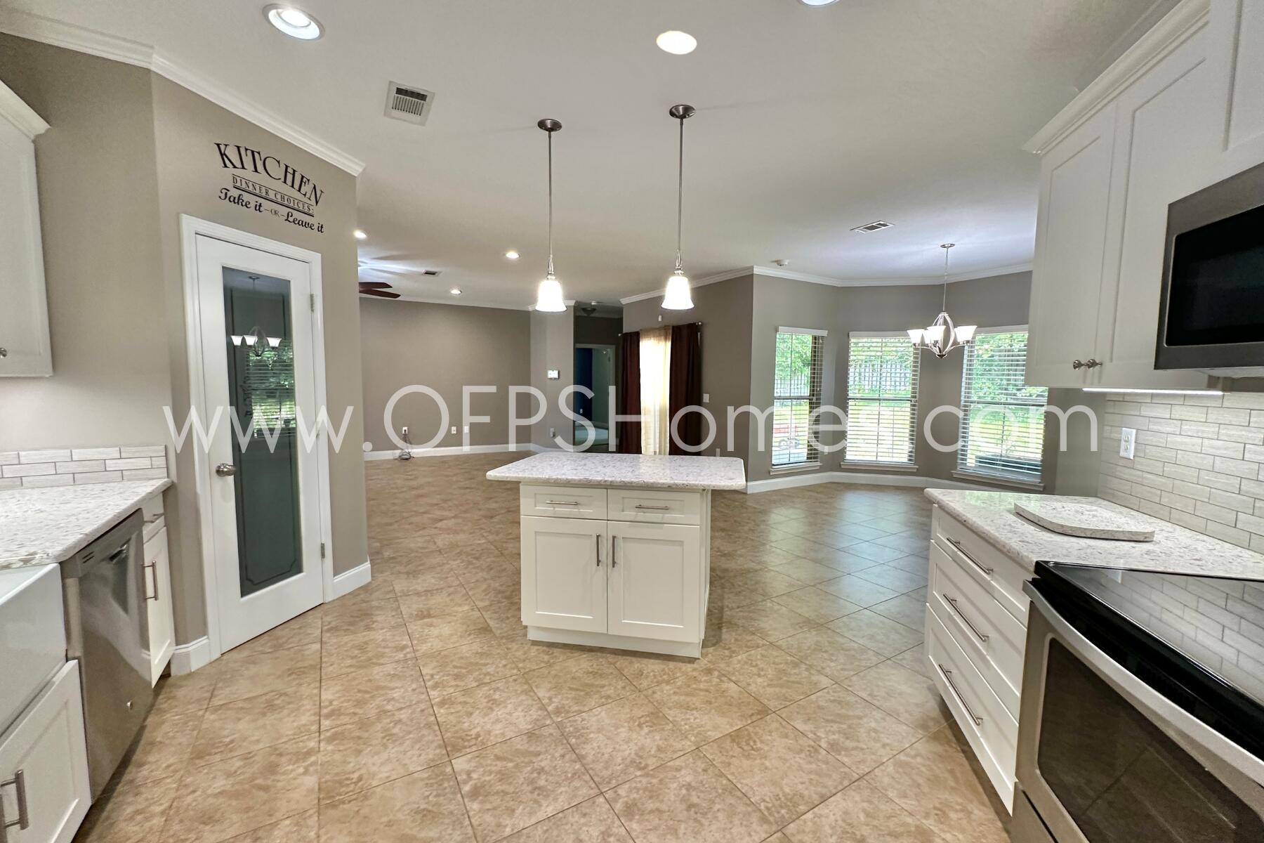 4542 Annabelle Lane Crestview, FL 32539 - Photo 19 of 35 a kitchen with a sink stove and refrigerator