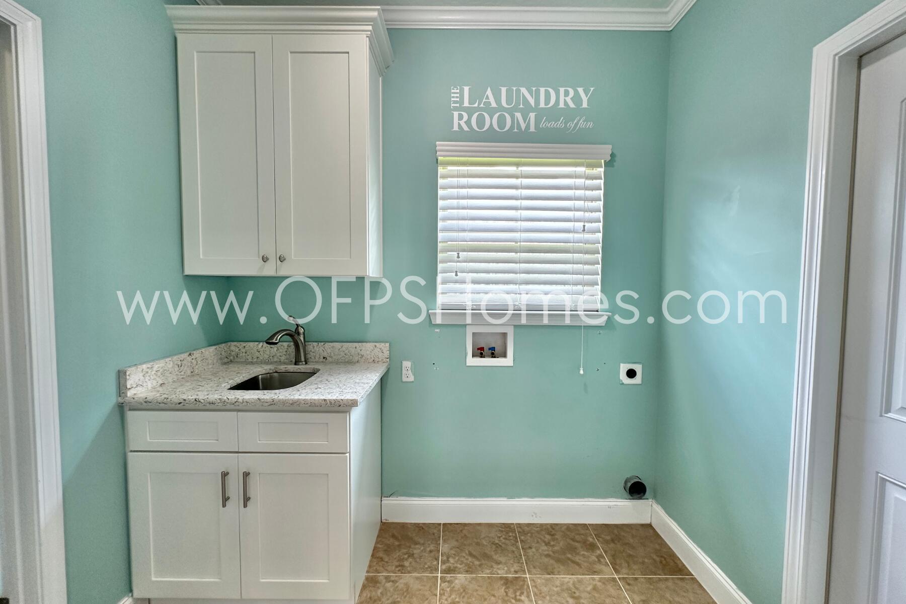 4542 Annabelle Lane Crestview, FL 32539 - Photo 20 of 35 a bathroom with a sink and cabinets