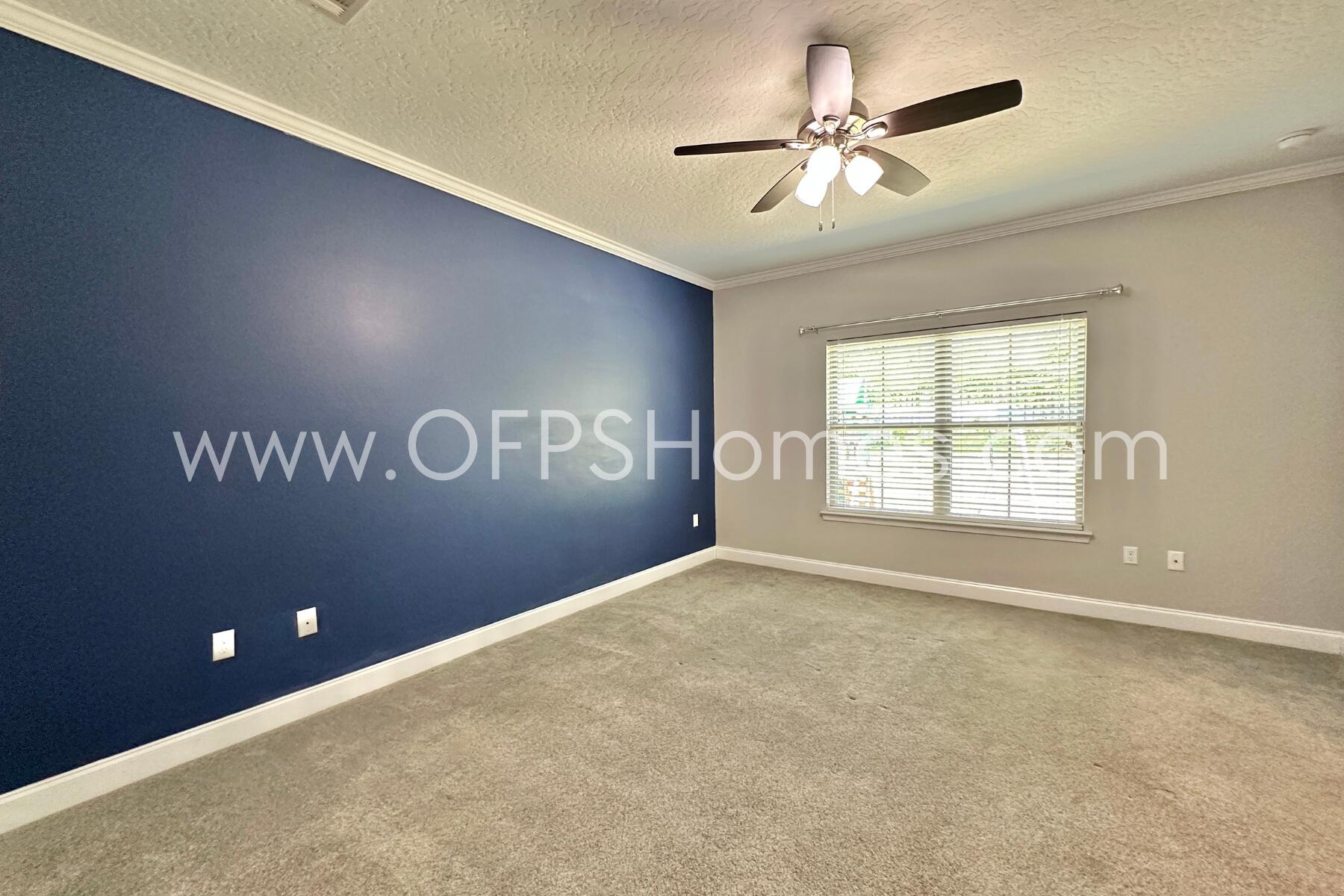 4542 Annabelle Lane Crestview, FL 32539 - Photo 25 of 35 an empty room with windows and fan