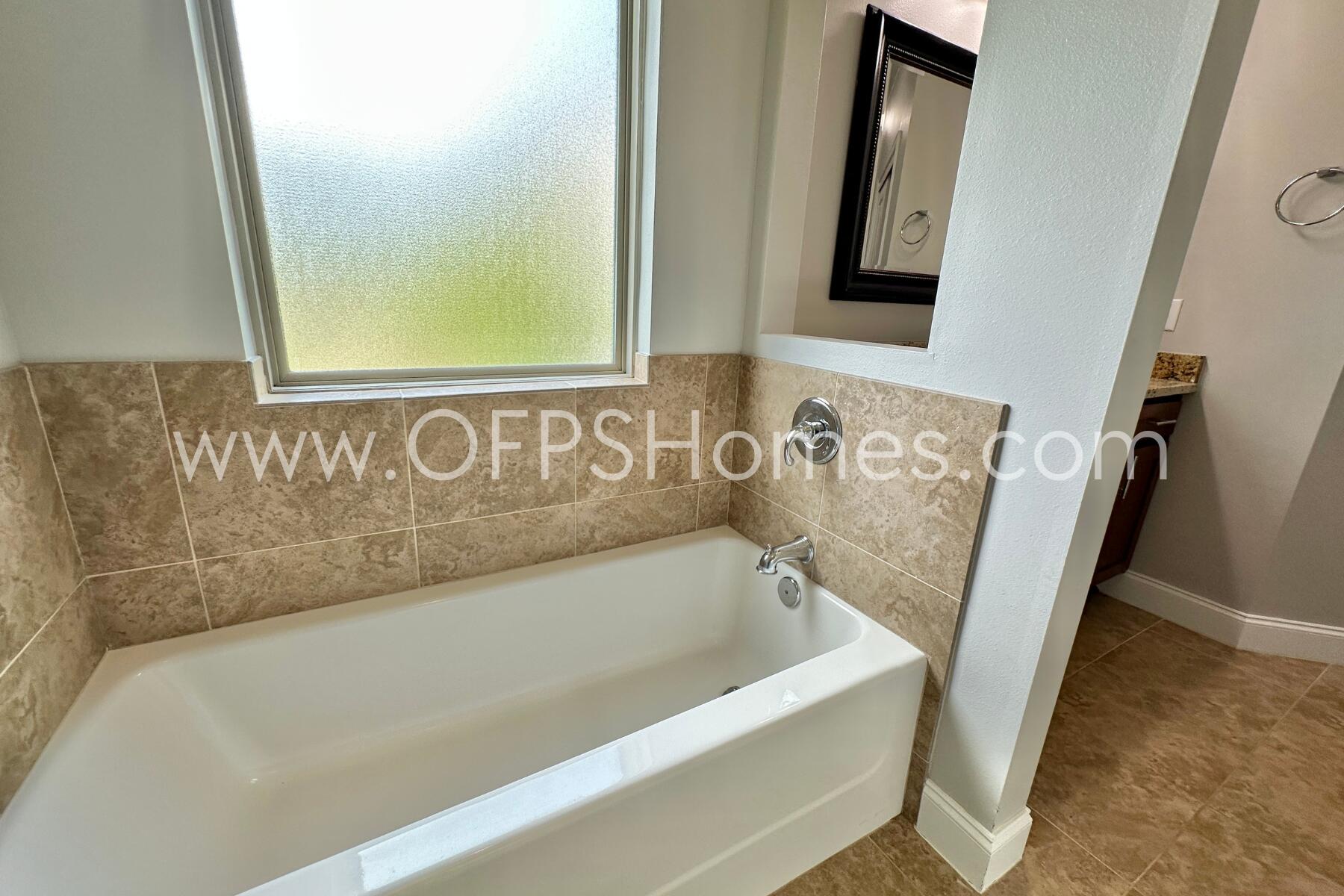4542 Annabelle Lane Crestview, FL 32539 - Photo 29 of 35 a bathroom with bathtub and shower
