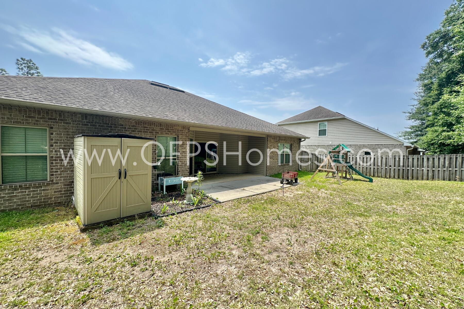 4542 Annabelle Lane Crestview, FL 32539 - Photo 34 of 35 a front view of a house with a yard and garage