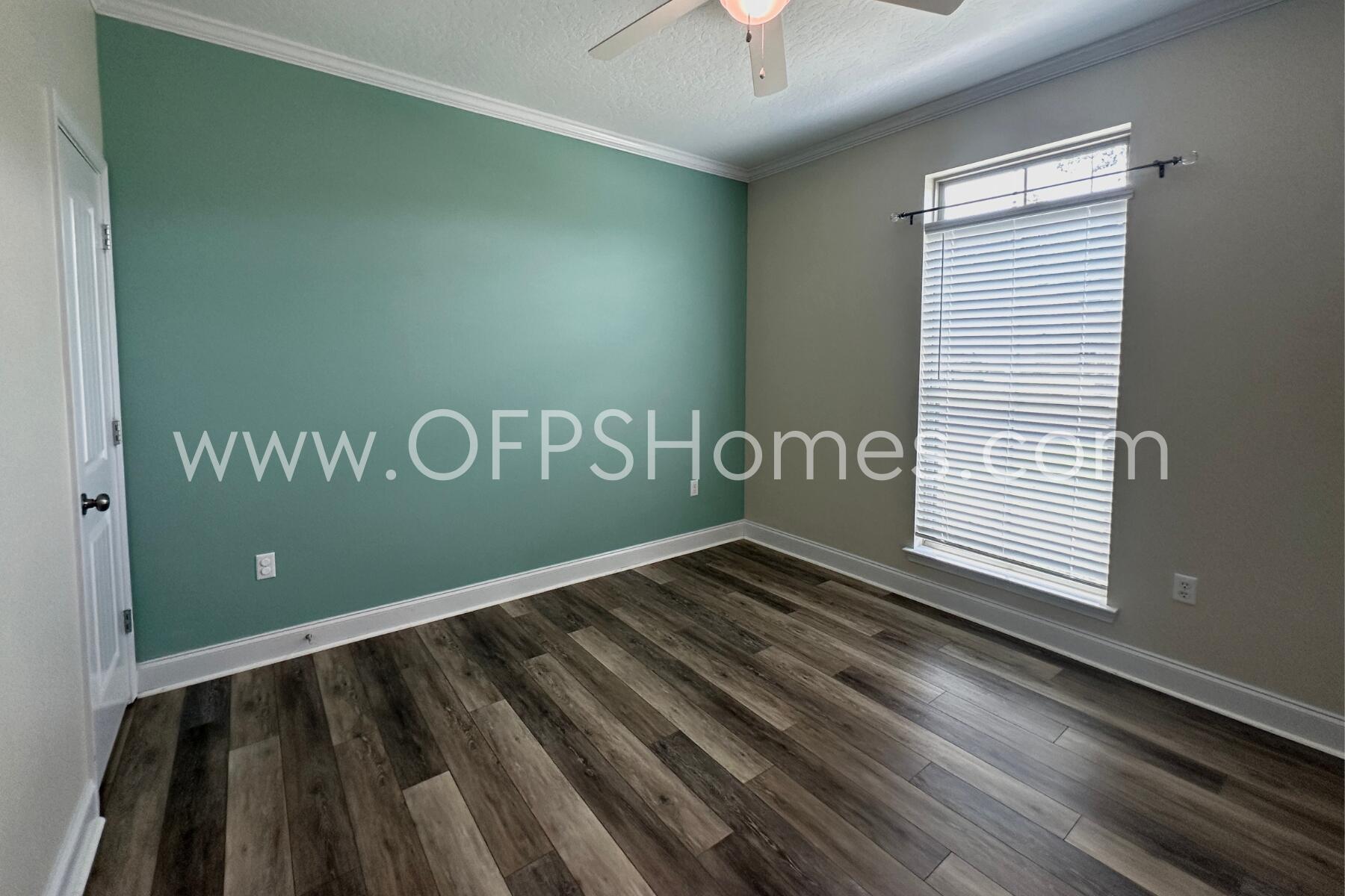 4542 Annabelle Lane Crestview, FL 32539 - Photo 4 of 35 a view of a room with stairs and wooden floor