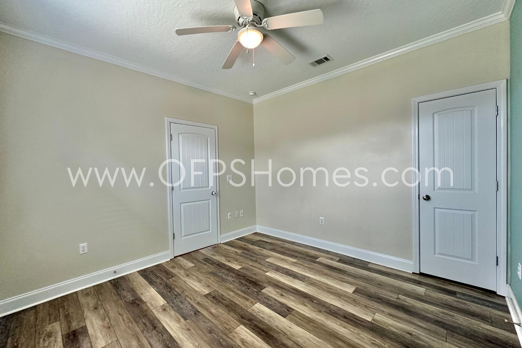 4542 Annabelle Lane Crestview, FL 32539 - Photo 5 of 35 a view of a room with wooden floor and staircase