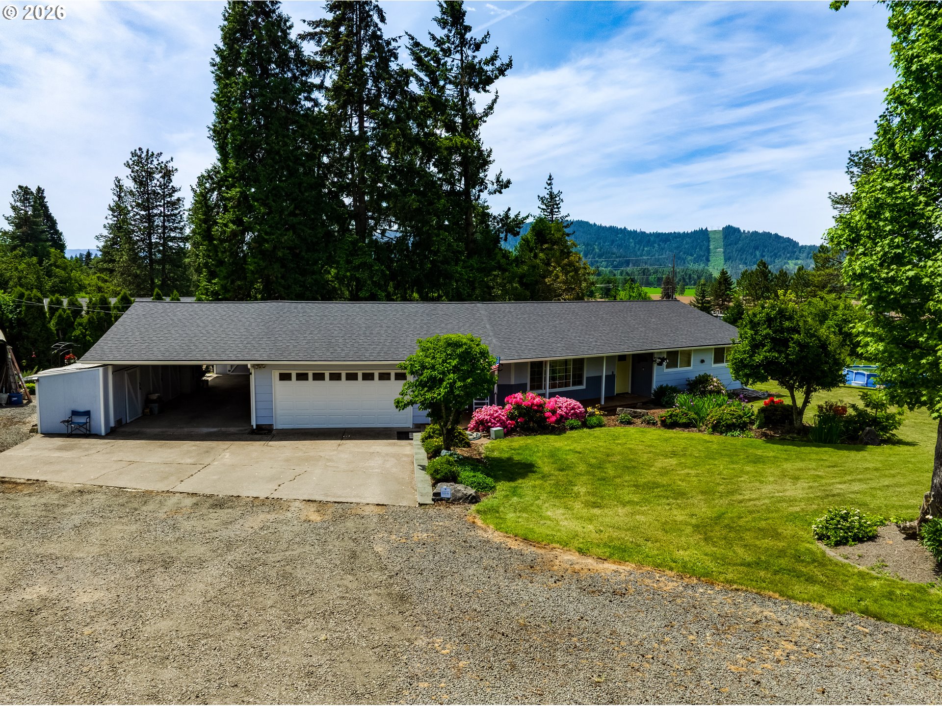 1088 Linda Lane Springfield, OR 97478 - Photo 1 of 43 a view of a house with a garden and pathway