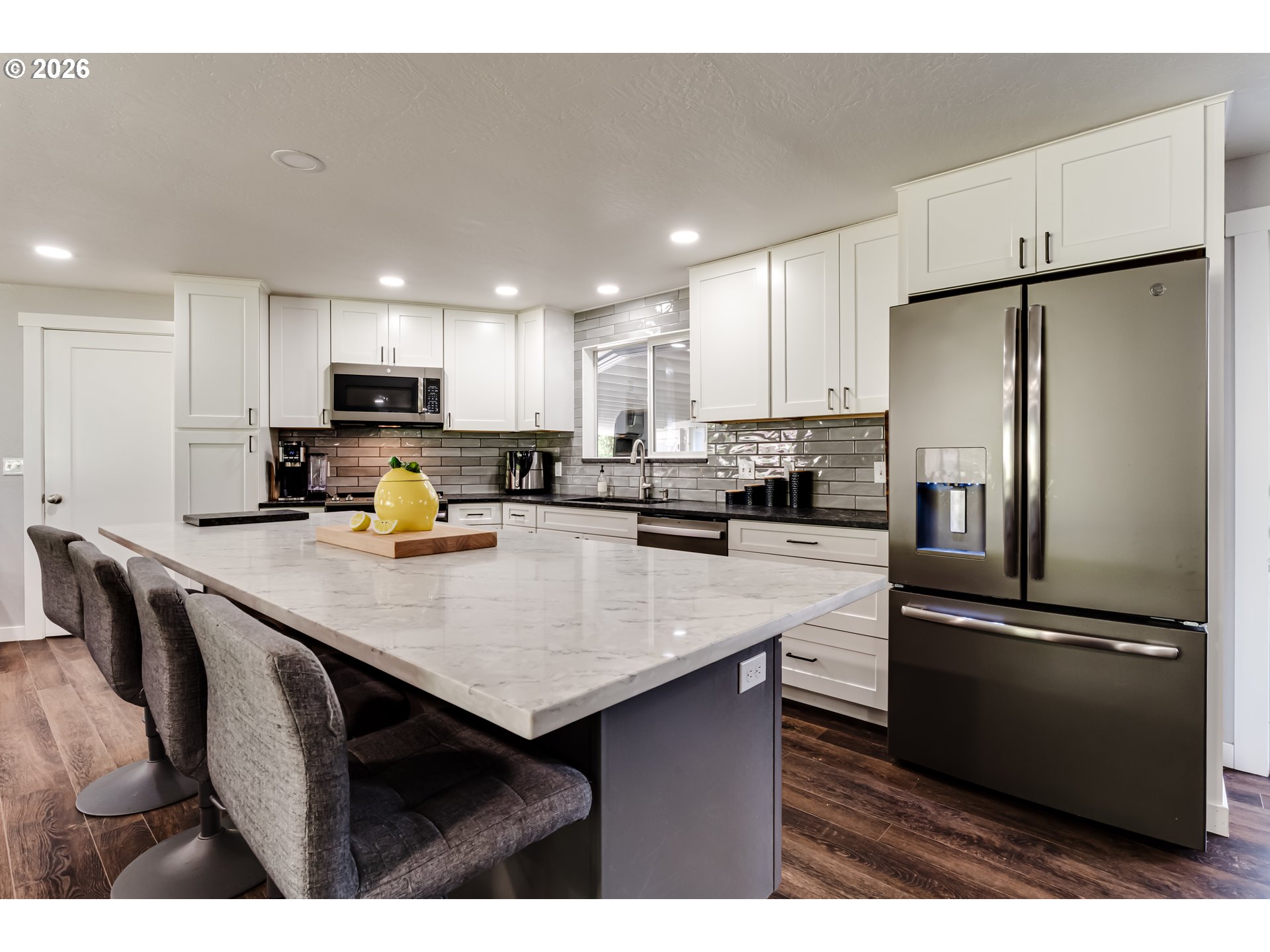 1088 Linda Lane Springfield, OR 97478 - Photo 14 of 43 a kitchen with kitchen island a refrigerator sink and cabinets