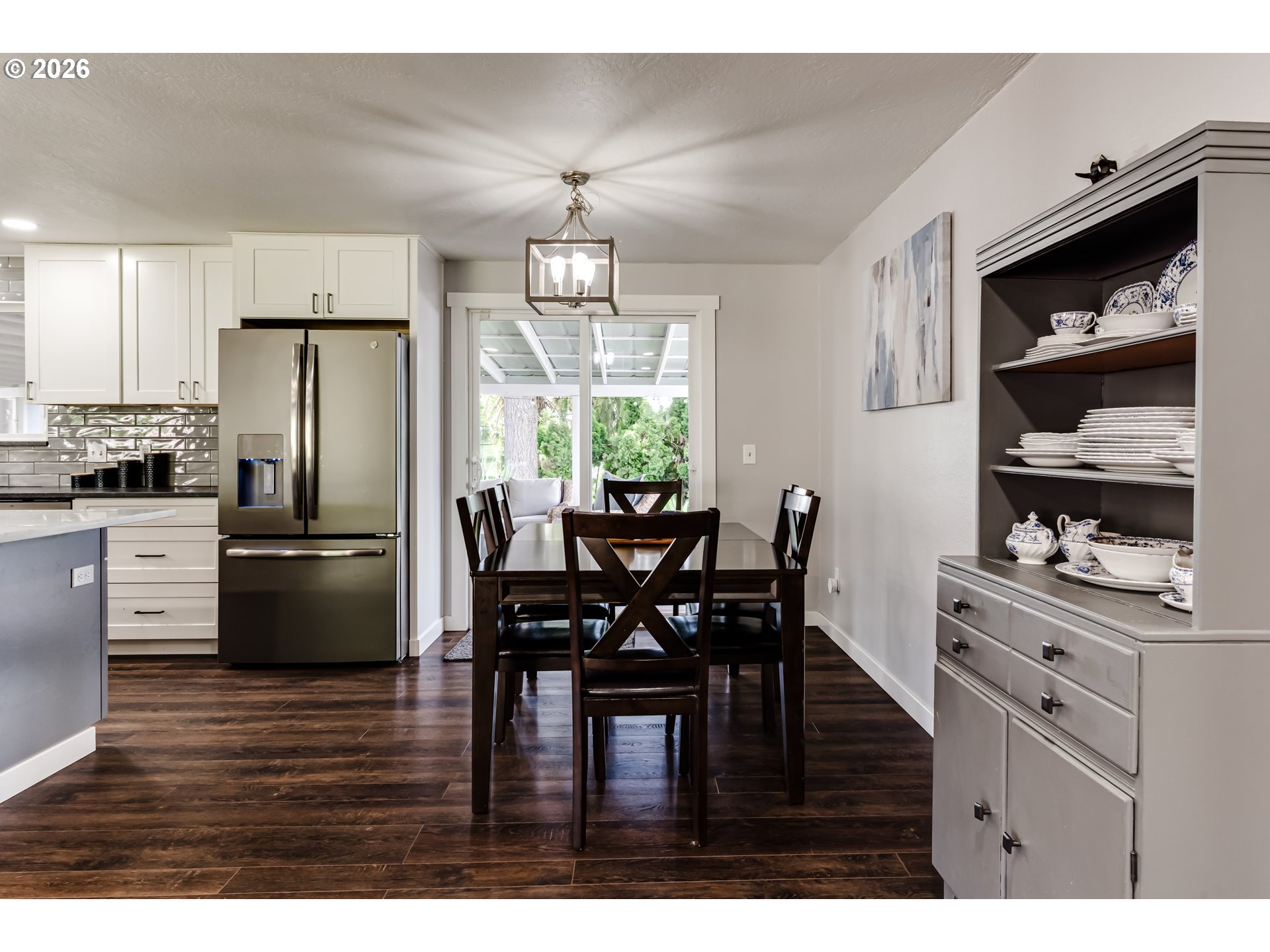 1088 Linda Lane Springfield, OR 97478 - Photo 15 of 43 a kitchen with stainless steel appliances wooden floor dining table and chairs