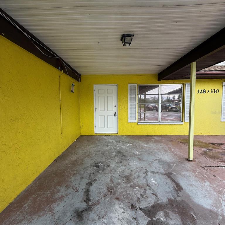 a view of an empty room with a window