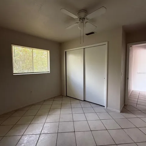 a view of an empty room with a window