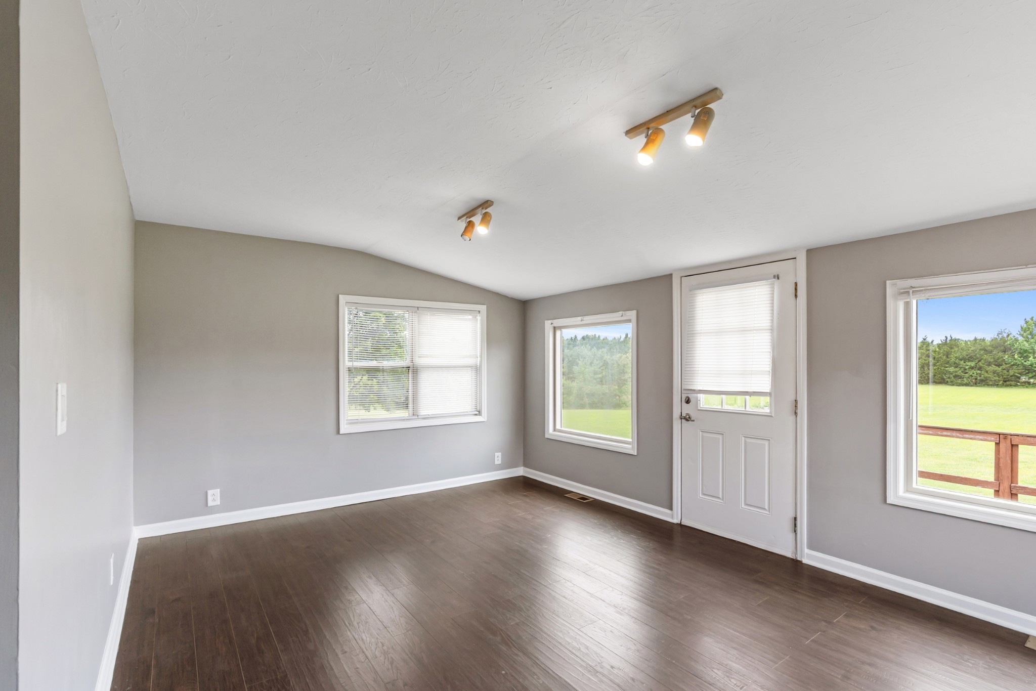 4602 Washington Road Springfield, TN 37172 - Photo 17 of 63 an empty room with wooden floor and windows