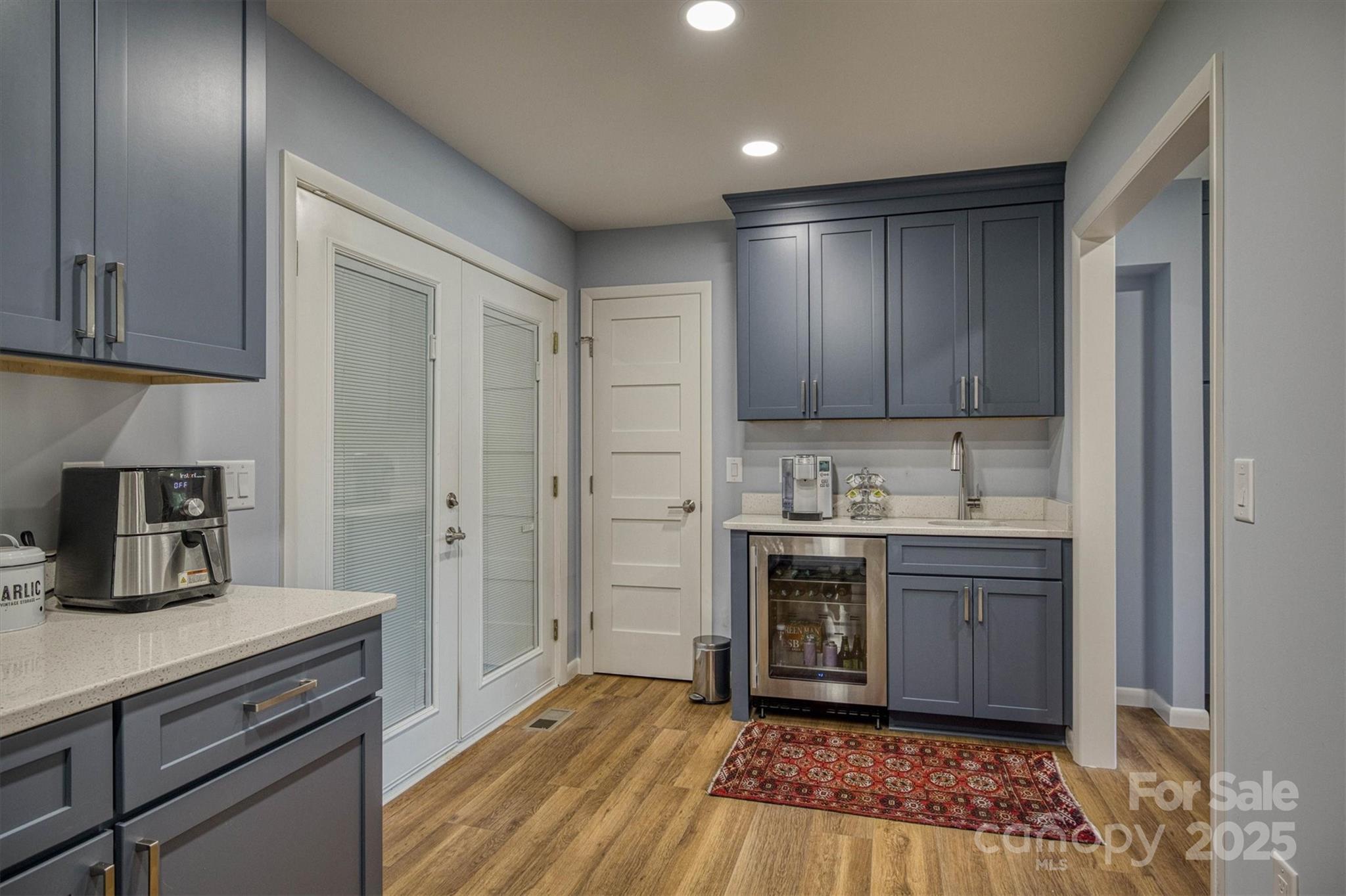 214 Howard Street Morganton, NC 28655 - Photo 15 of 29 a kitchen with kitchen island granite countertop a sink cabinets and stainless steel appliances