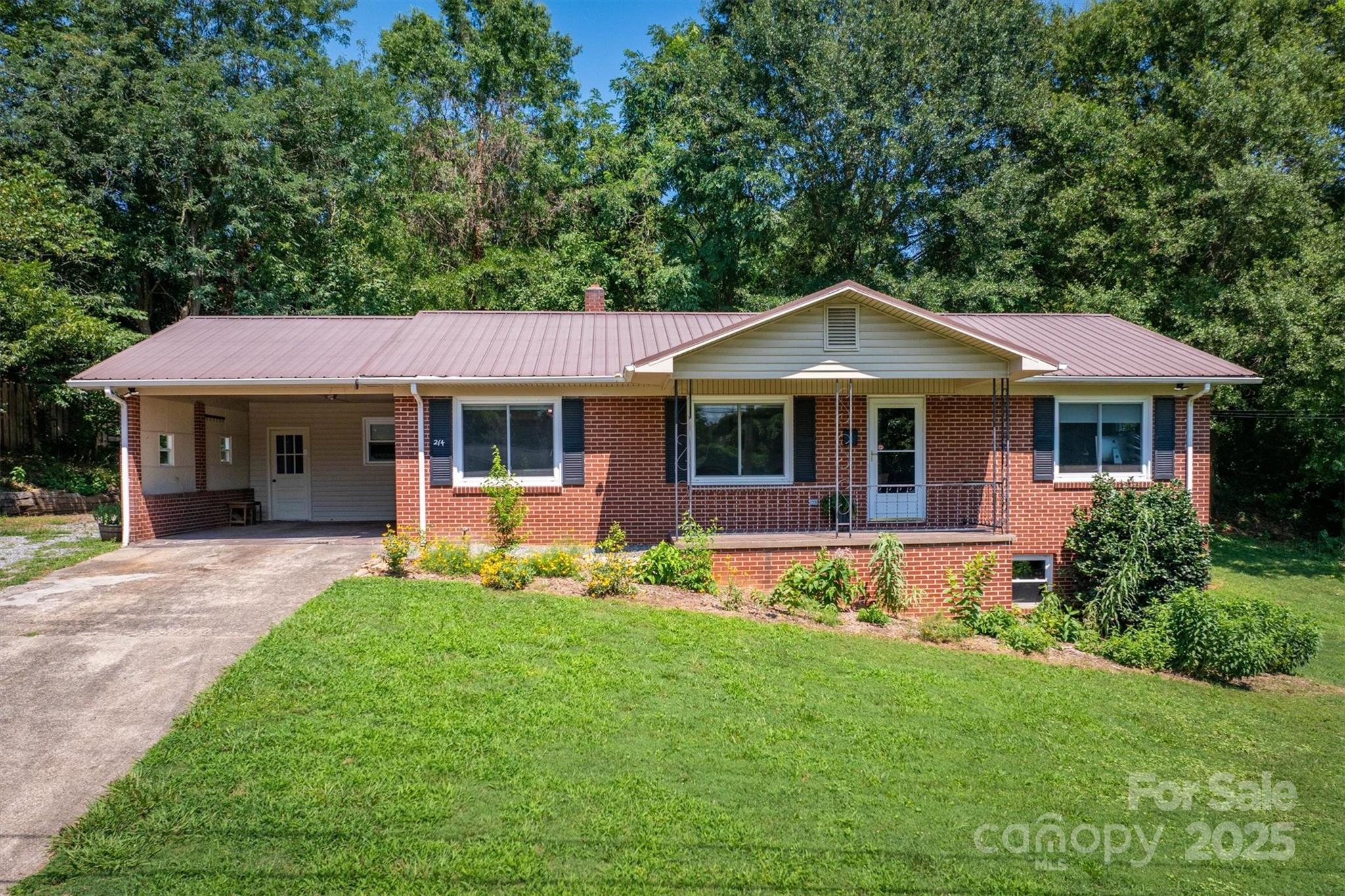 214 Howard Street Morganton, NC 28655 - Photo 3 of 29 a front view of a house with a yard