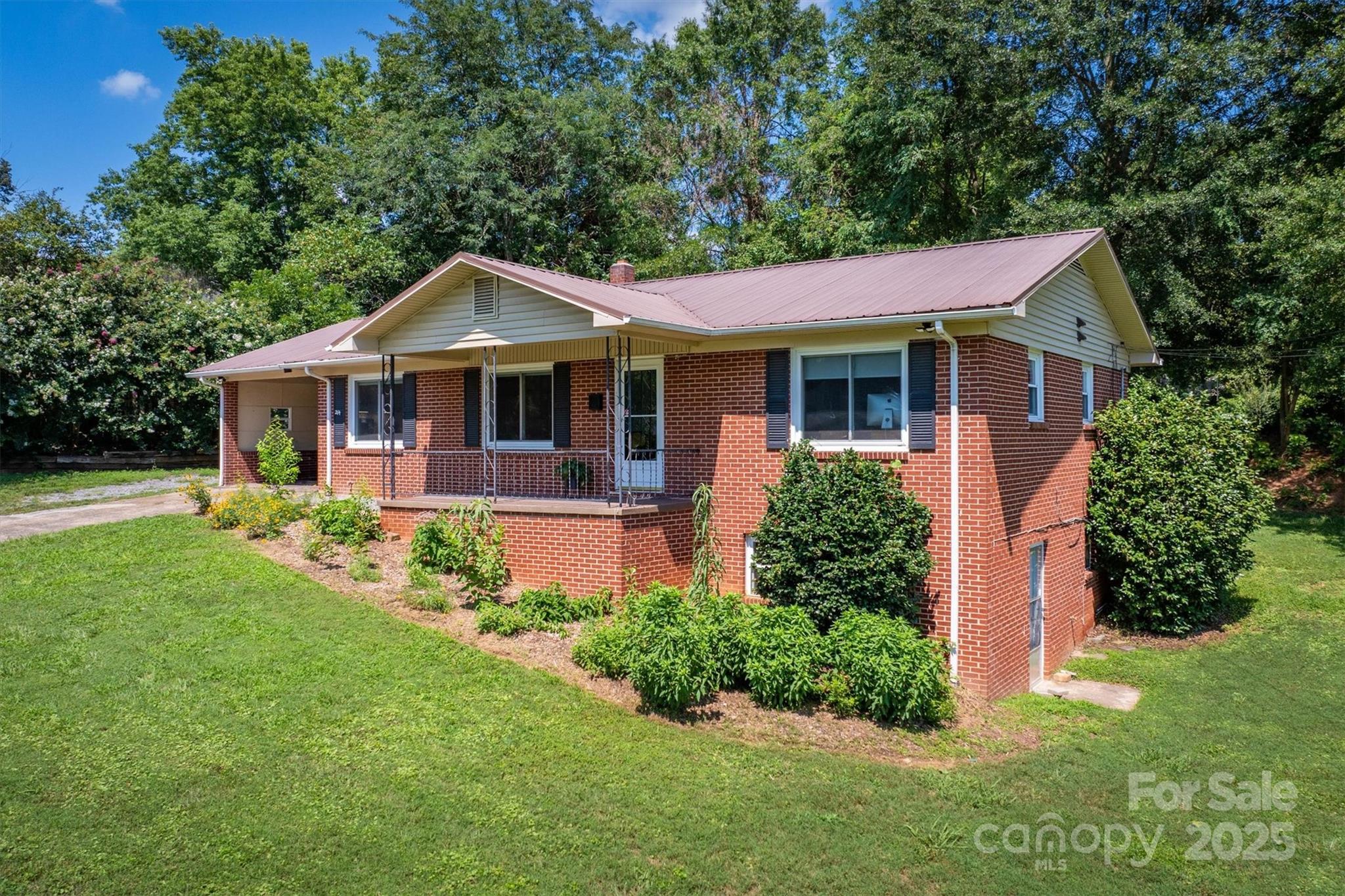 214 Howard Street Morganton, NC 28655 - Photo 4 of 29 a front view of a house with a yard