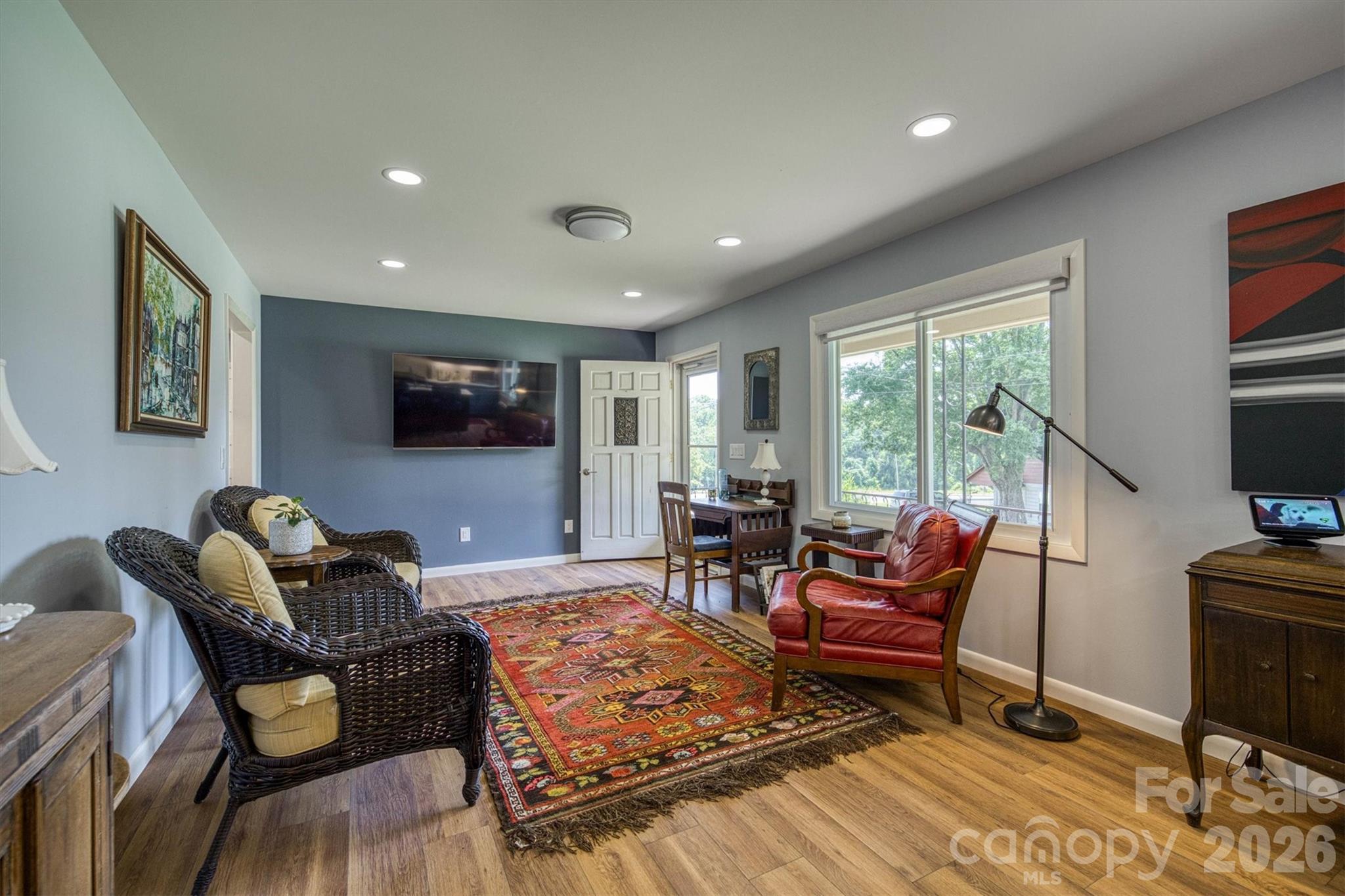 214 Howard Street Morganton, NC 28655 - Photo 5 of 22 a living room with furniture and a flat screen tv