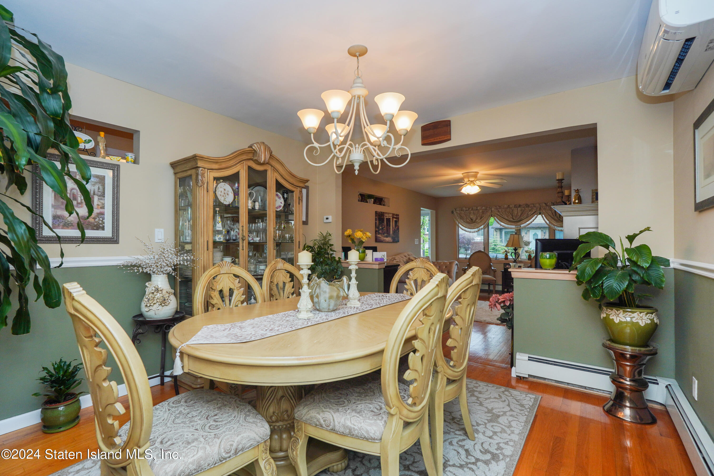 50 Ridgecrest Avenue Staten Island, NY 10312 - Photo 13 of 34 a view of a dining room with furniture and chandelier