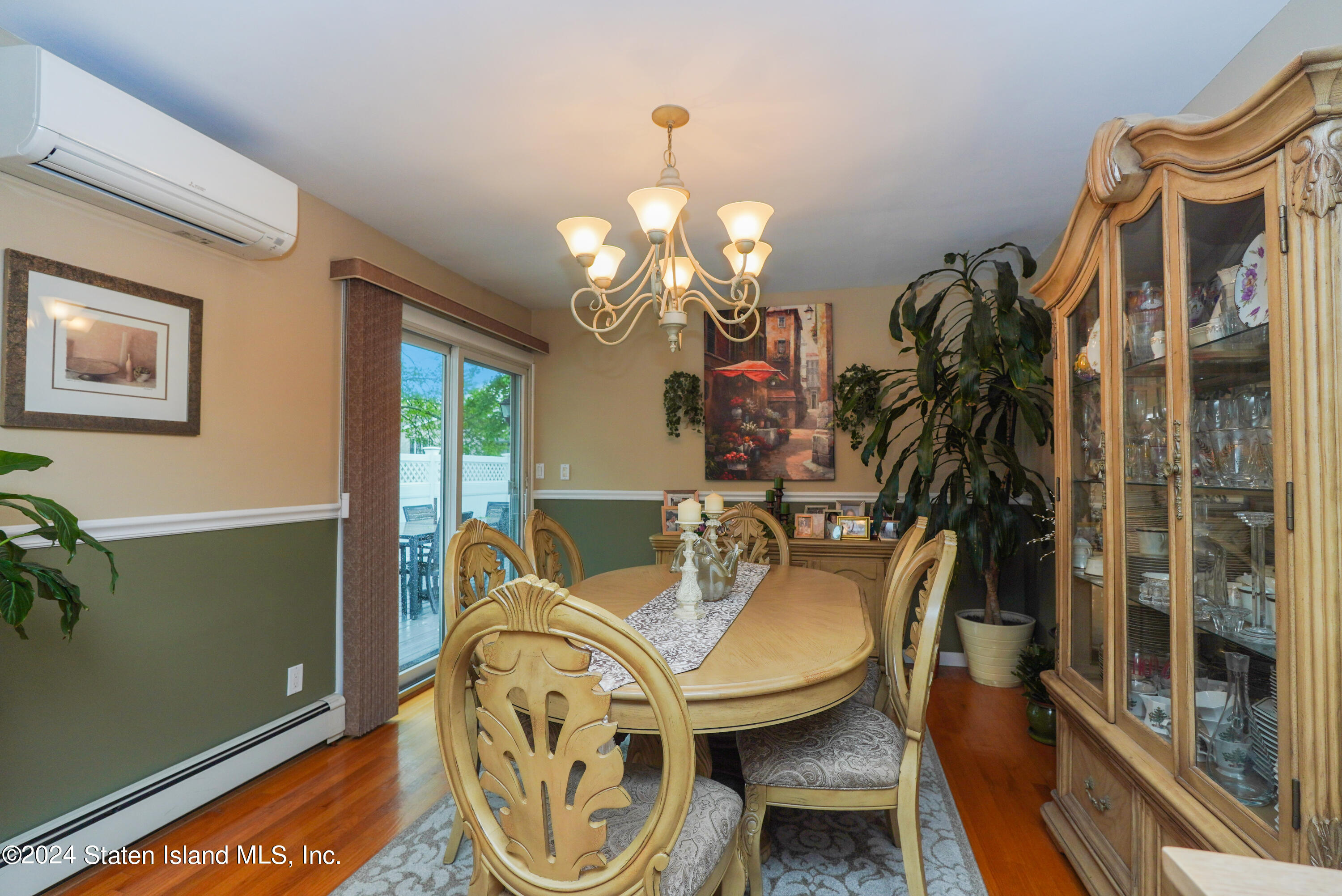 50 Ridgecrest Avenue Staten Island, NY 10312 - Photo 14 of 34 a view of a dining room with furniture and chandelier