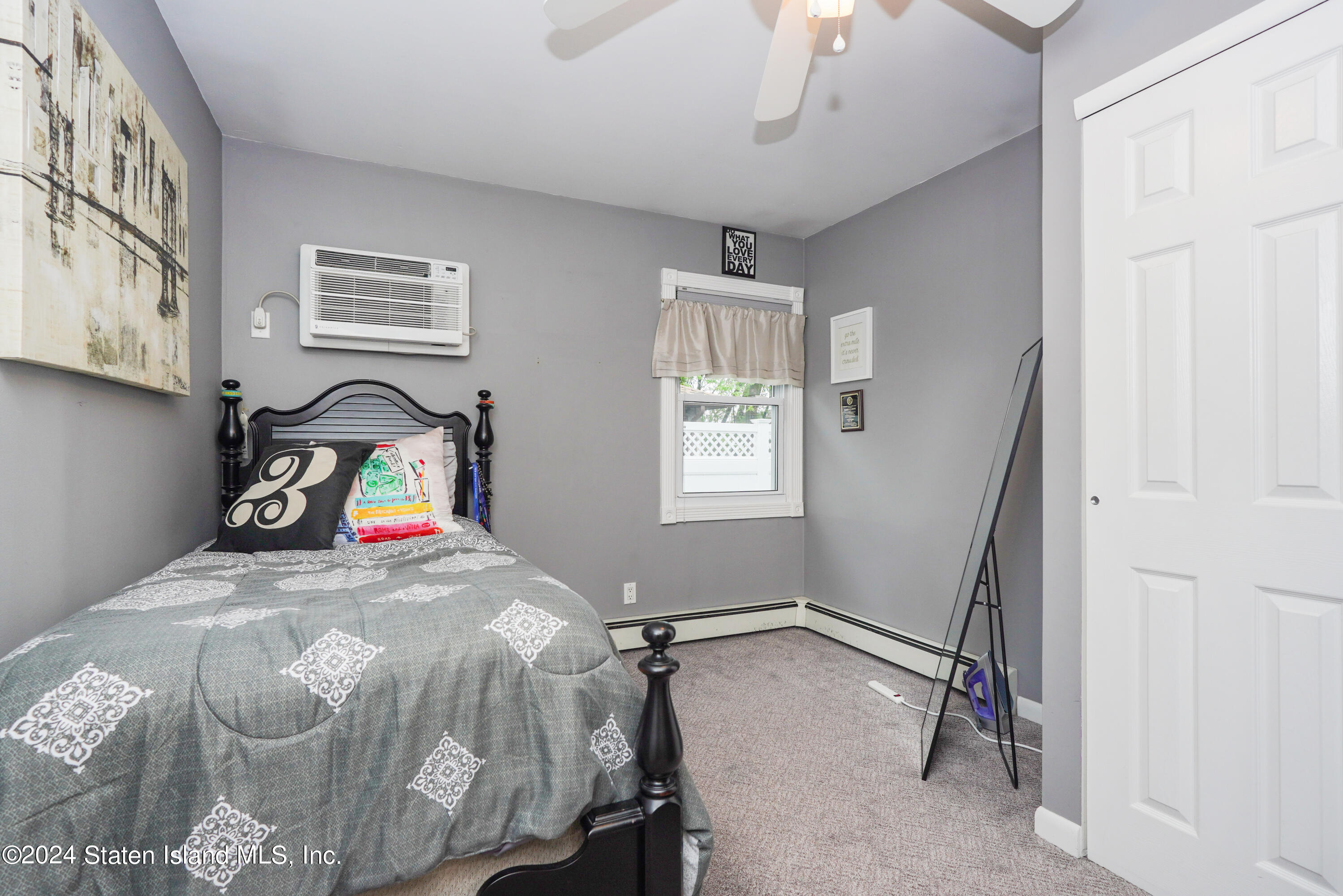 50 Ridgecrest Avenue Staten Island, NY 10312 - Photo 18 of 34 a bedroom with a bed and a window