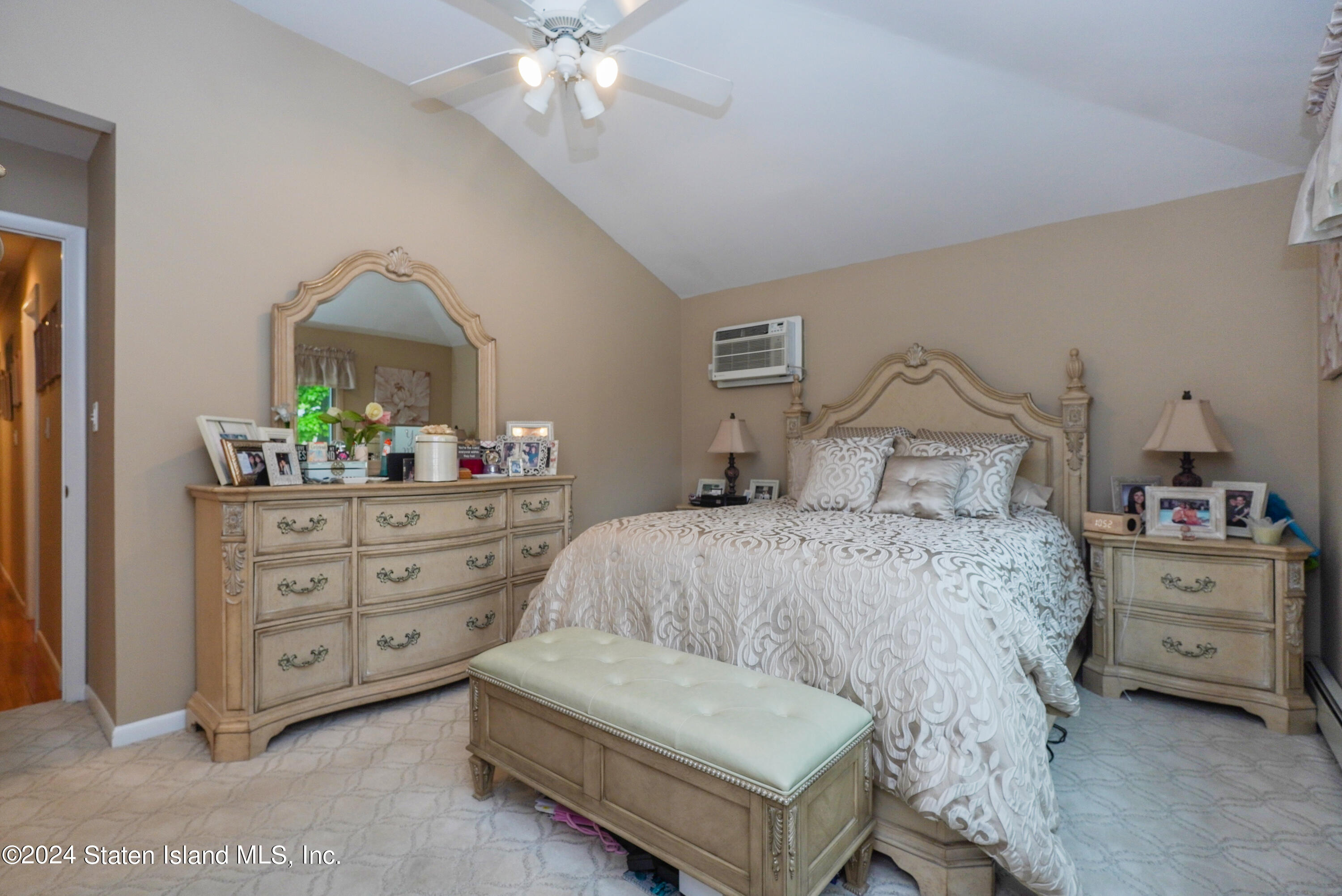 50 Ridgecrest Avenue Staten Island, NY 10312 - Photo 19 of 34 a bedroom with a bed and a dresser