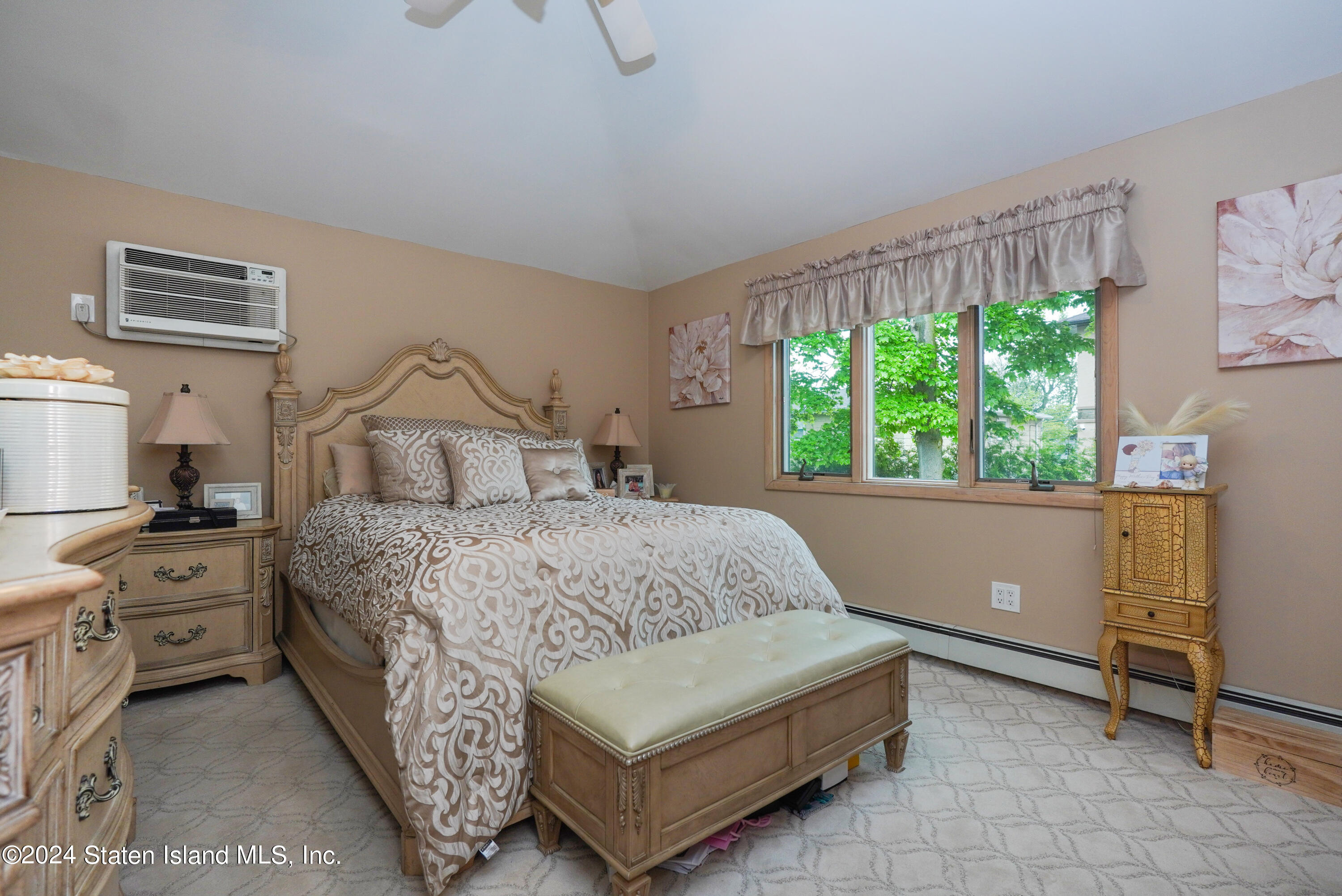 50 Ridgecrest Avenue Staten Island, NY 10312 - Photo 20 of 34 a bedroom with a large bed and windows