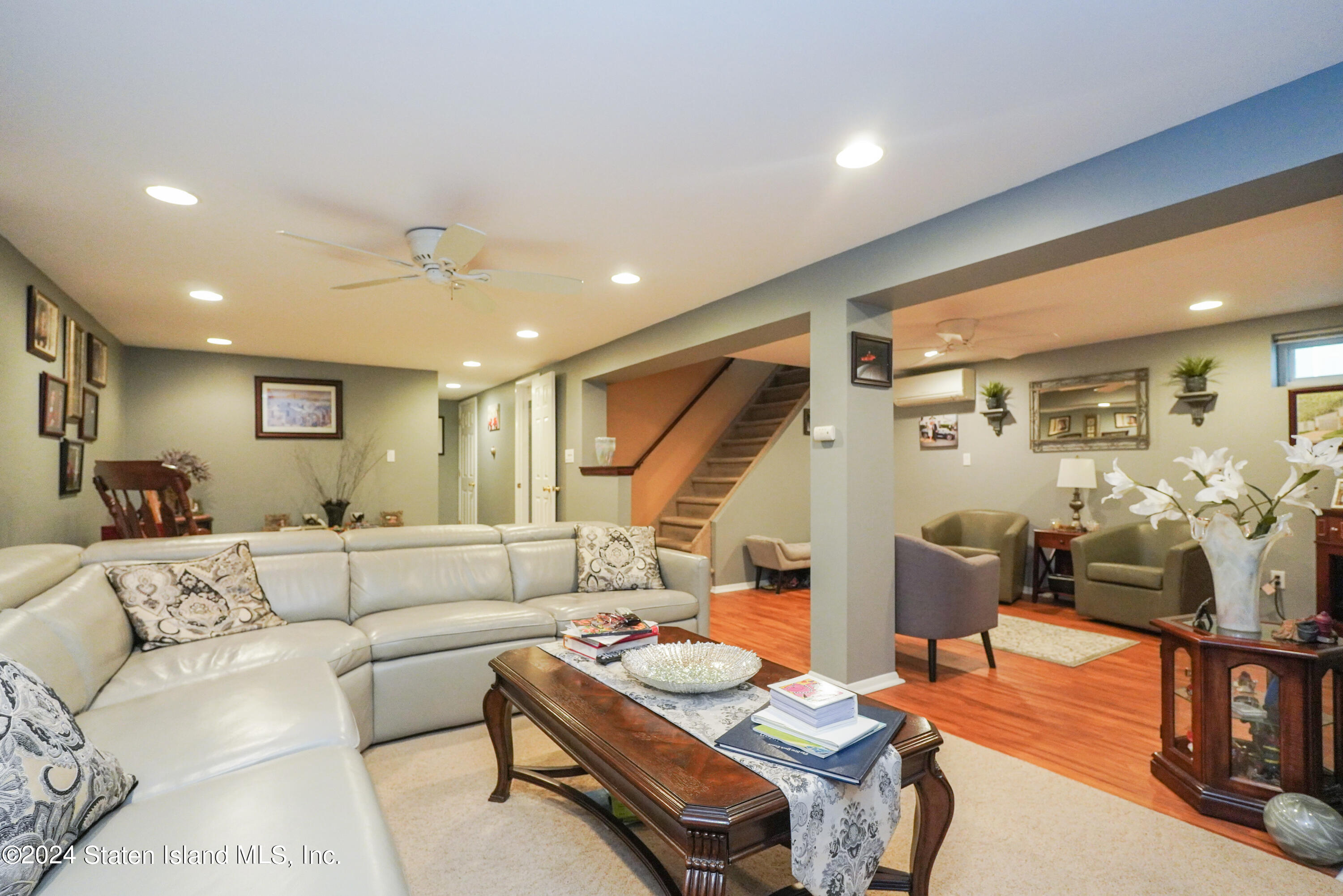 50 Ridgecrest Avenue Staten Island, NY 10312 - Photo 24 of 34 a living room with furniture and wooden floor