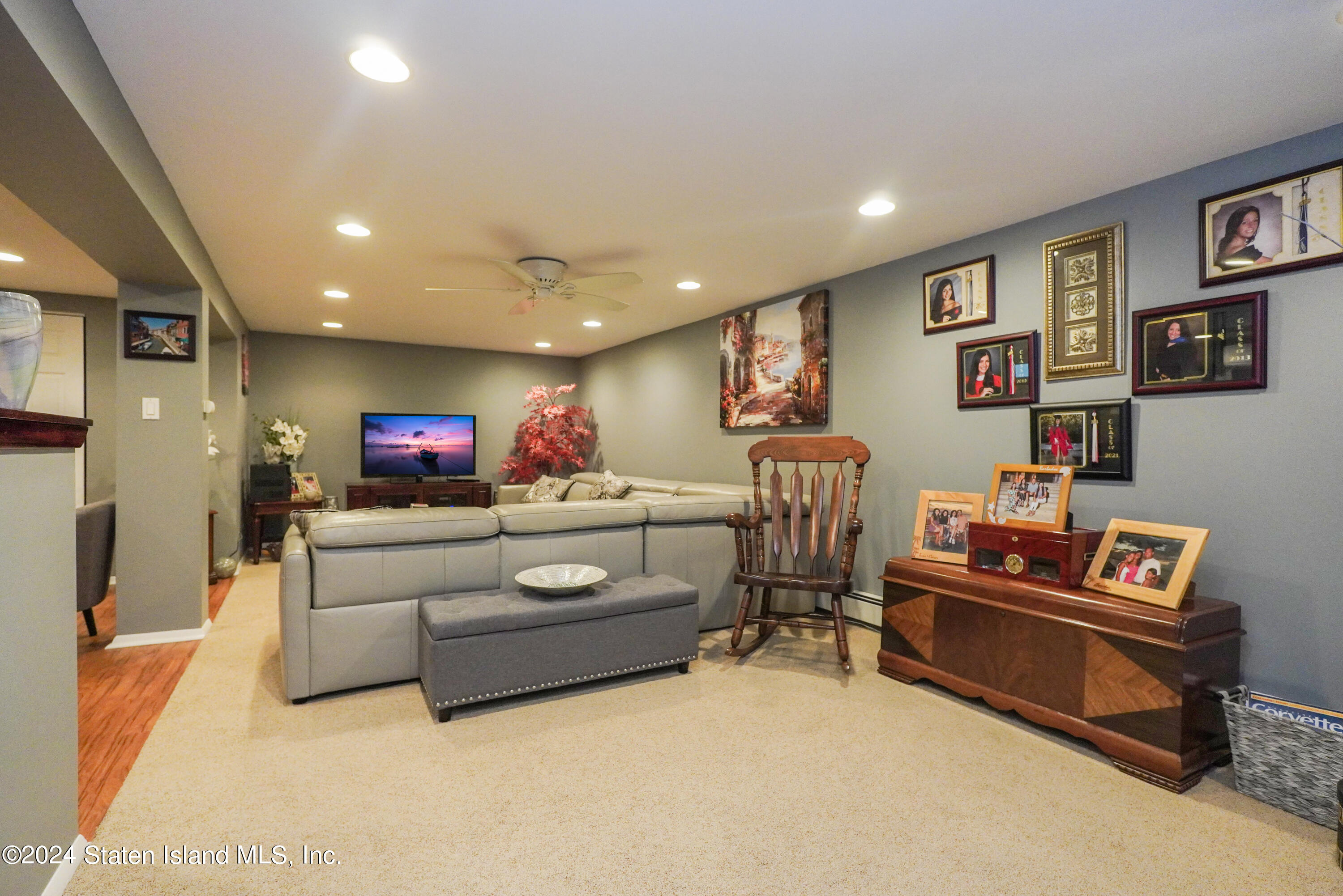 50 Ridgecrest Avenue Staten Island, NY 10312 - Photo 26 of 34 a living room with furniture and a flat screen tv