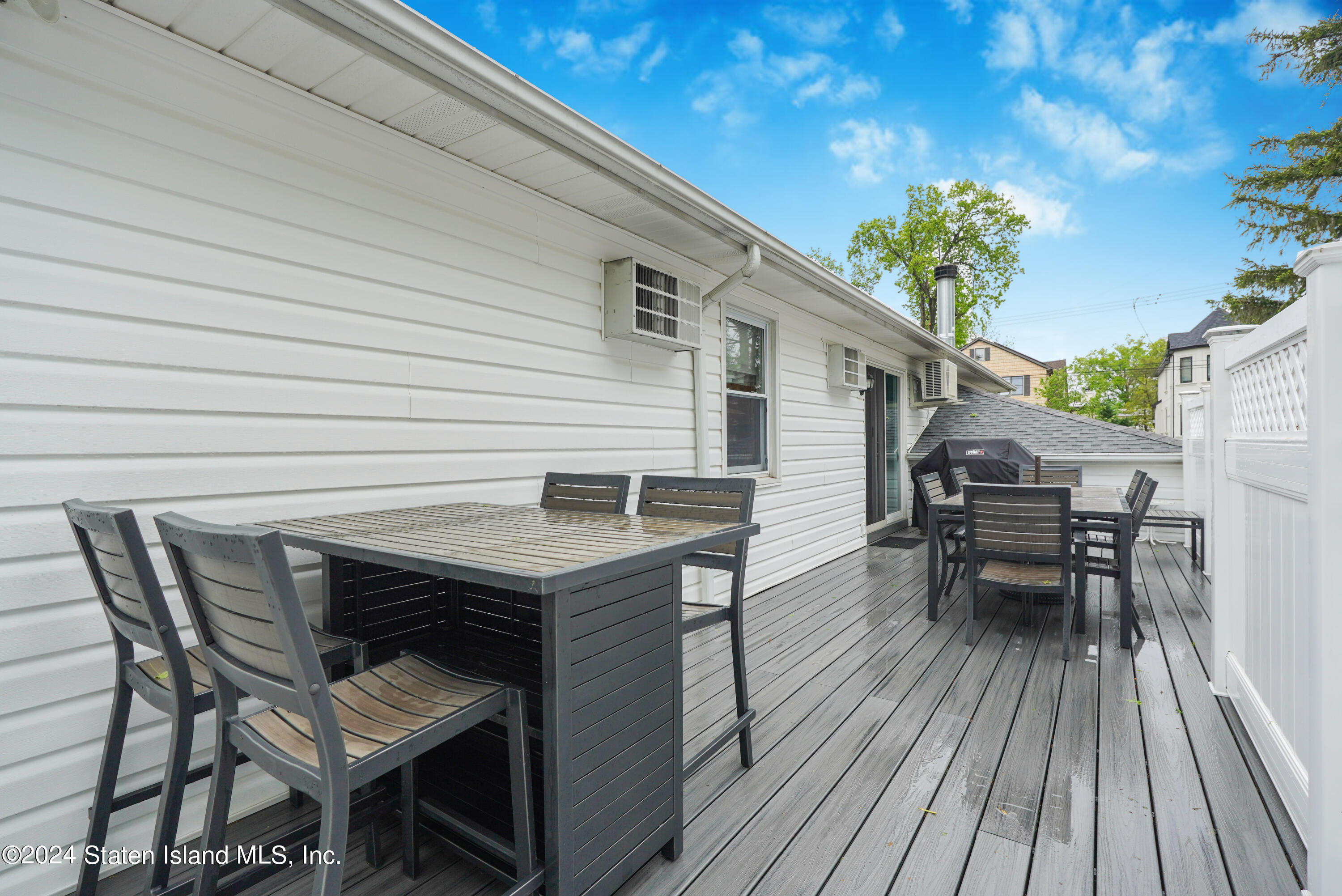 50 Ridgecrest Avenue Staten Island, NY 10312 - Photo 32 of 34 a roof deck with table and chairs