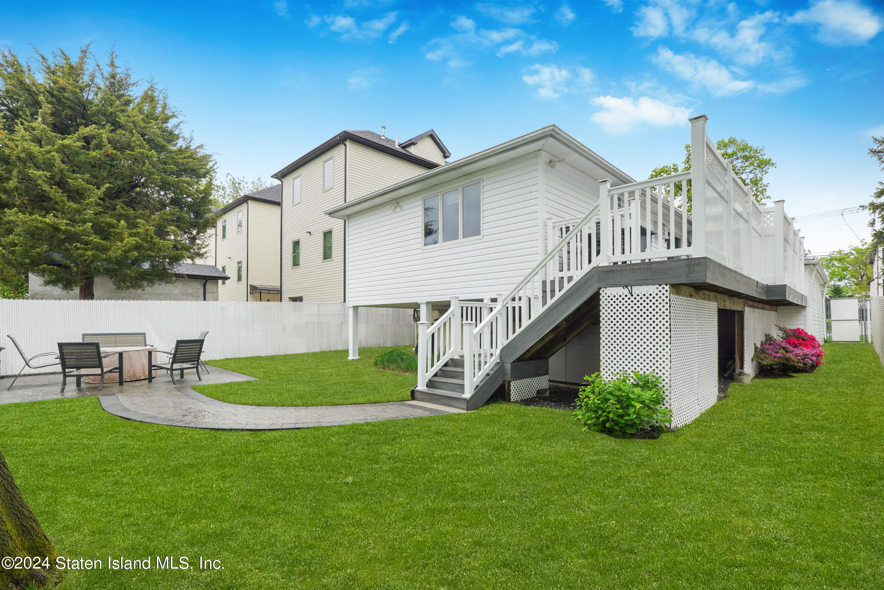 50 Ridgecrest Avenue Staten Island, NY 10312 - Photo 33 of 34 a view of a house with a yard and sitting area