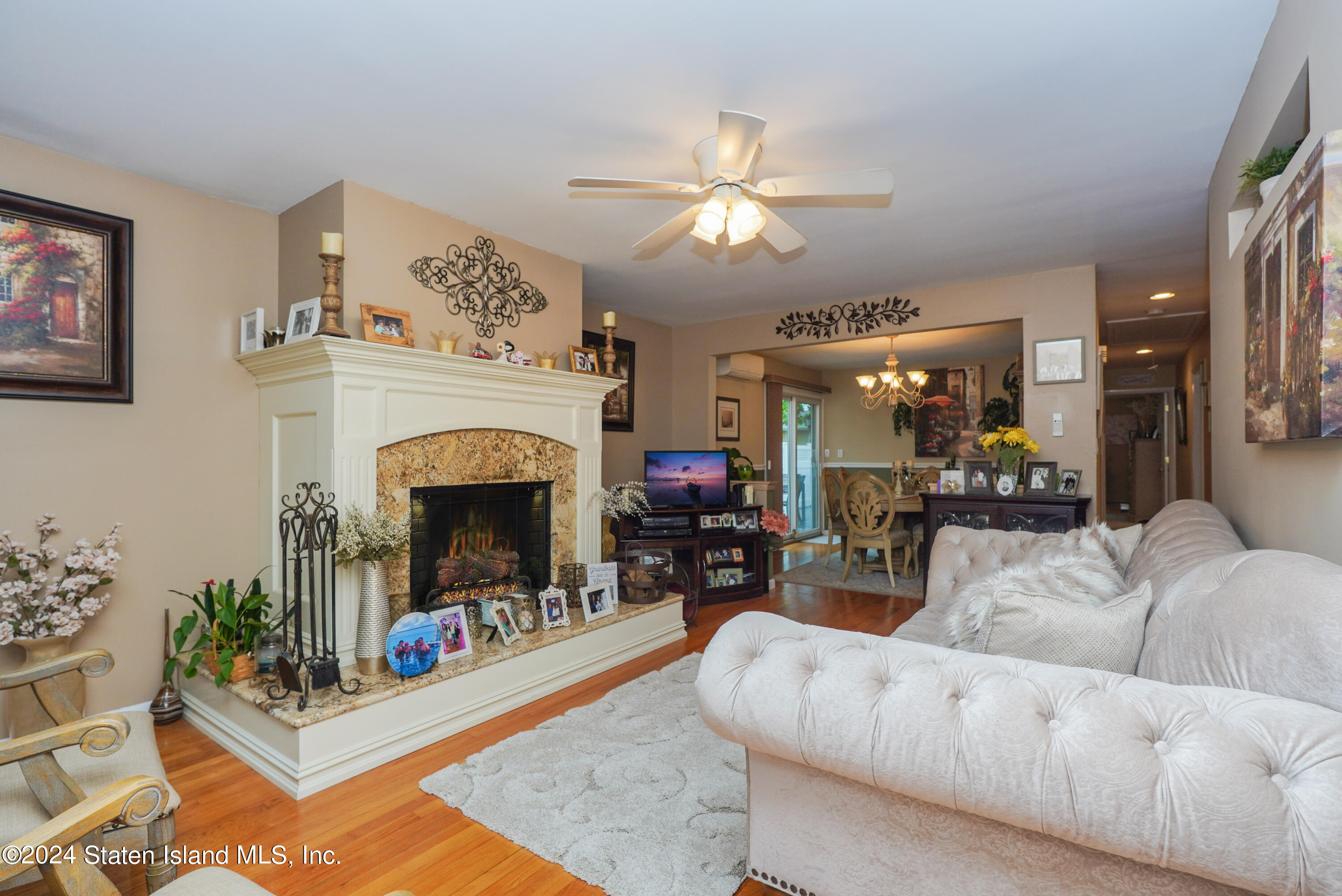 50 Ridgecrest Avenue Staten Island, NY 10312 - Photo 4 of 34 a living room with furniture and a fireplace