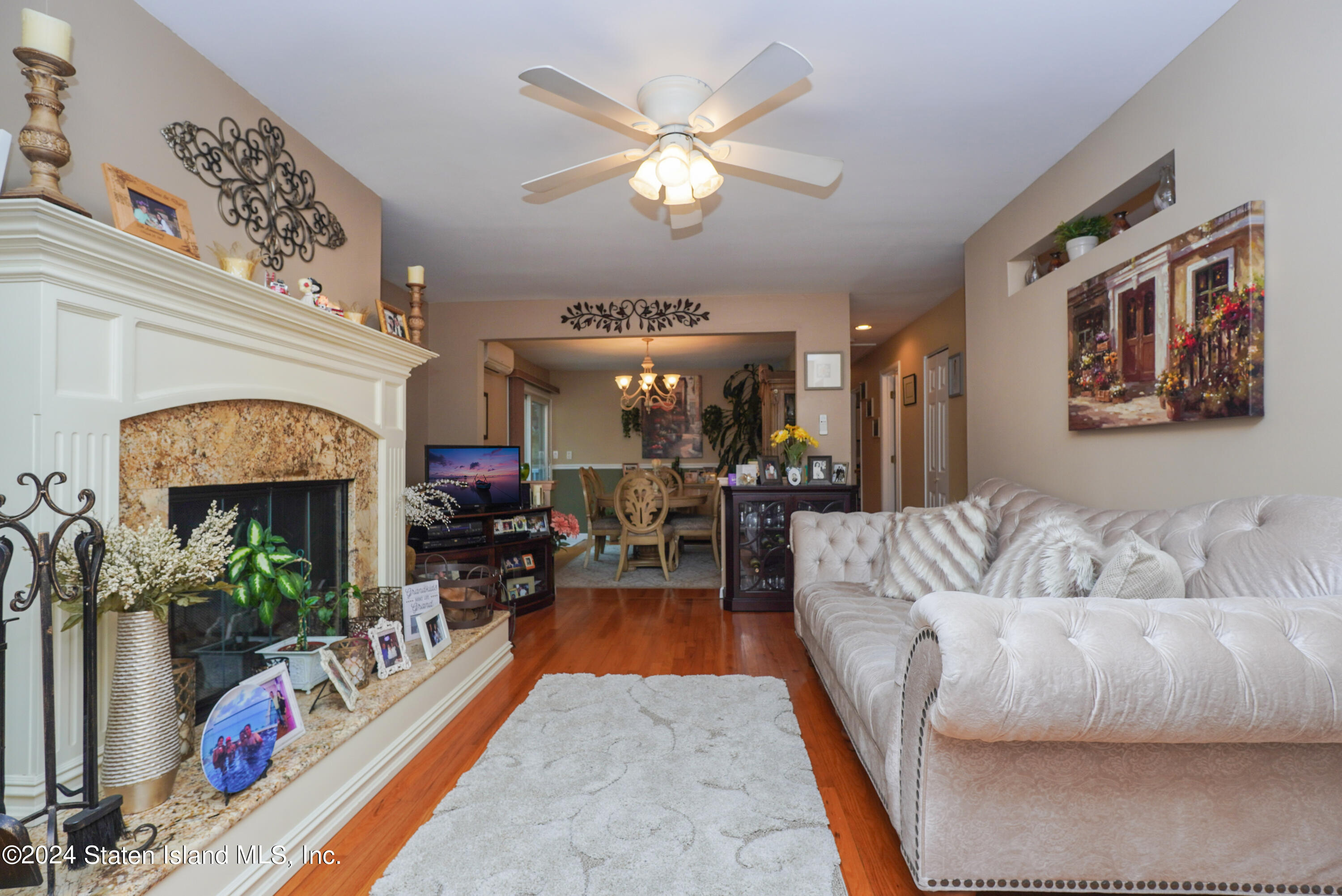 50 Ridgecrest Avenue Staten Island, NY 10312 - Photo 6 of 34 a living room with furniture and a fireplace