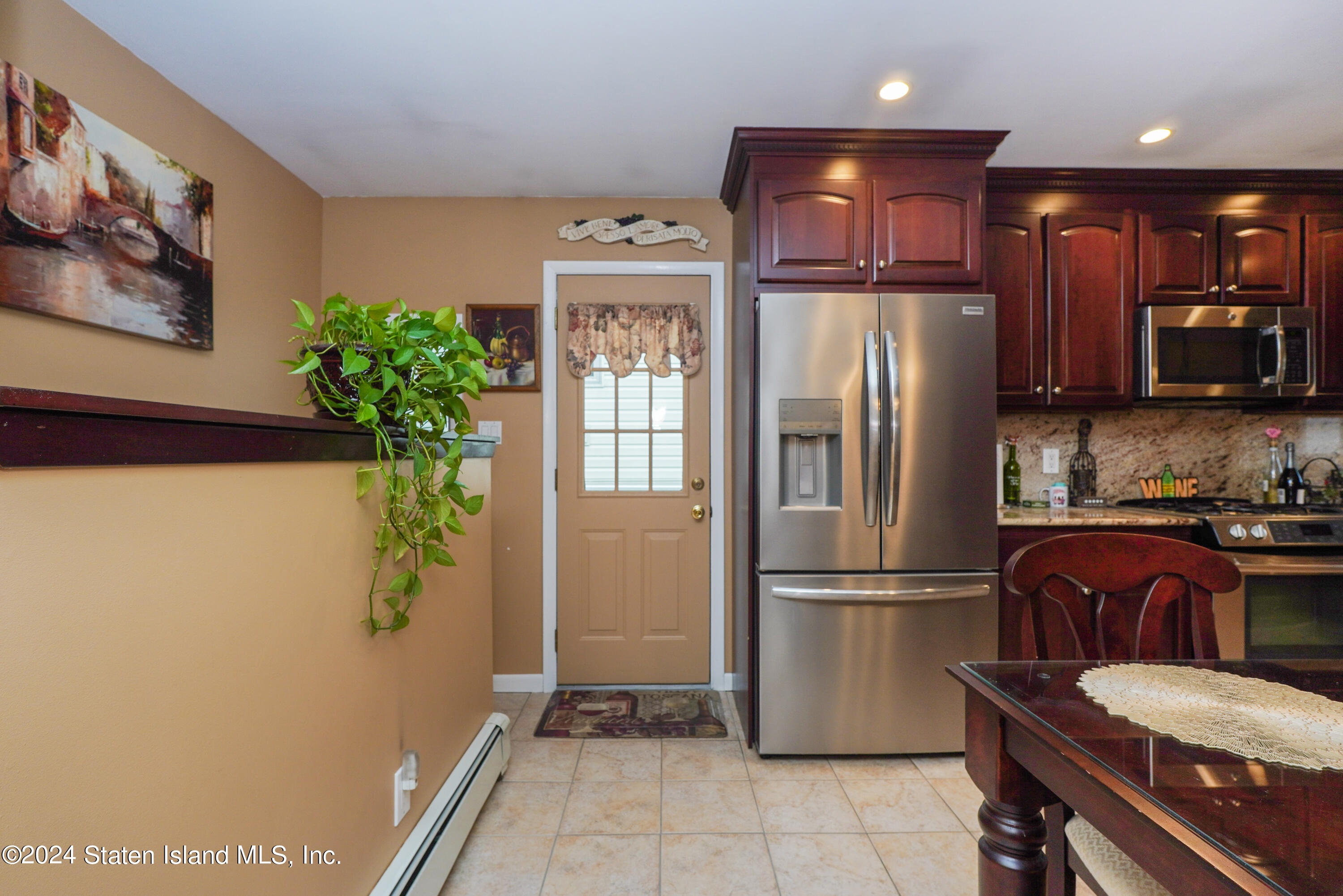 50 Ridgecrest Avenue Staten Island, NY 10312 - Photo 7 of 34 a kitchen with stainless steel appliances granite countertop a refrigerator and a sink