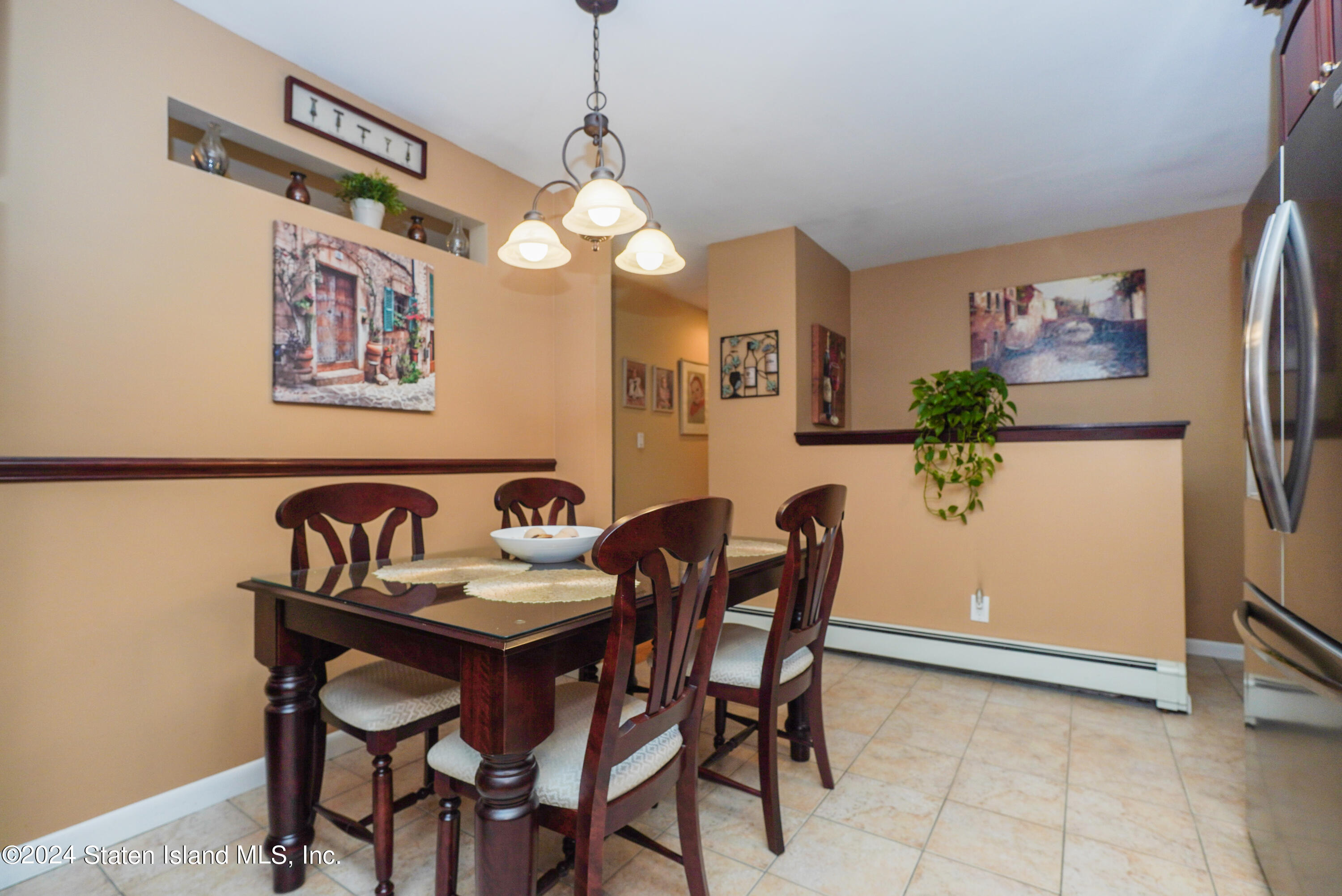 50 Ridgecrest Avenue Staten Island, NY 10312 - Photo 10 of 34 a view of a dining room with furniture and chandelier