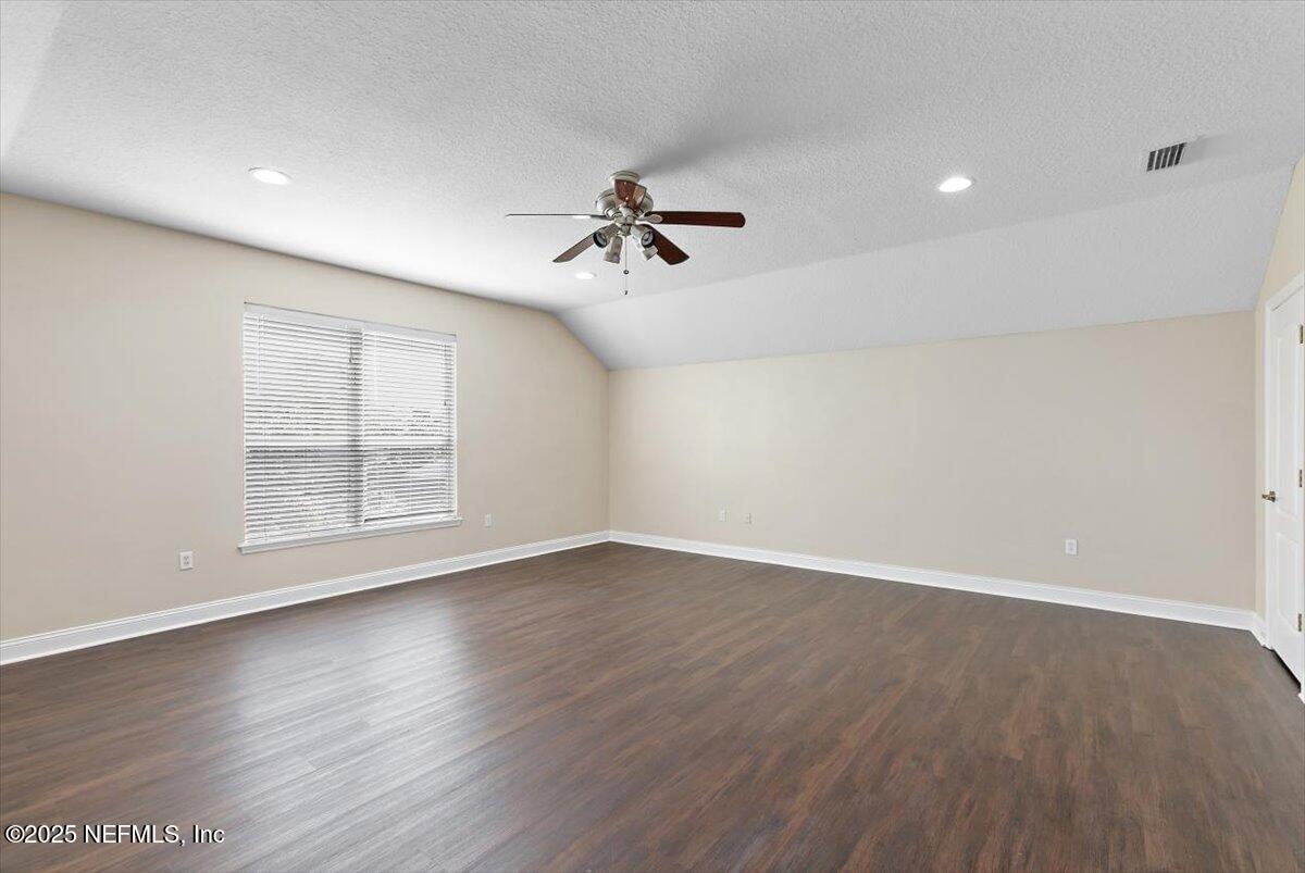 1124 Westfield Way St. Augustine, FL 32095 - Photo 24 of 29 wooden floor in an empty room with a window