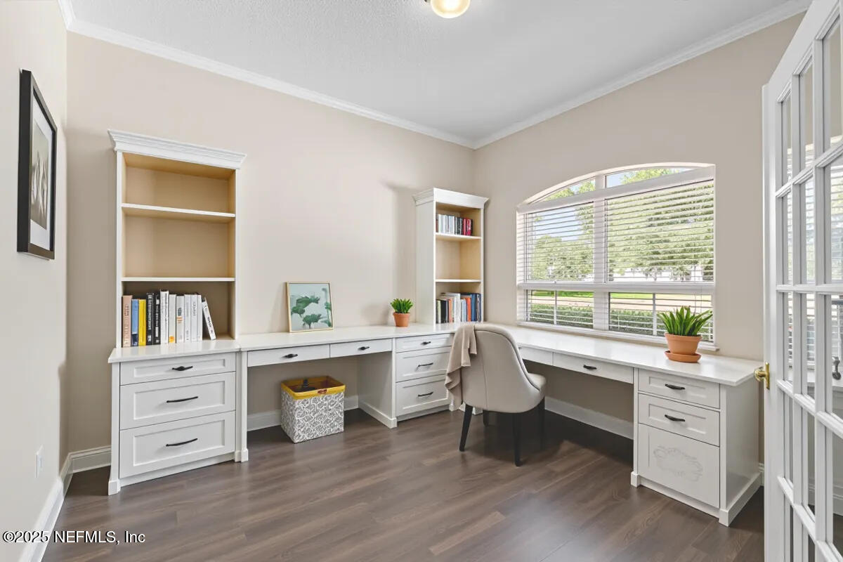 1124 Westfield Way St. Augustine, FL 32095 - Photo 4 of 29 a view of a workspace with furniture and a window