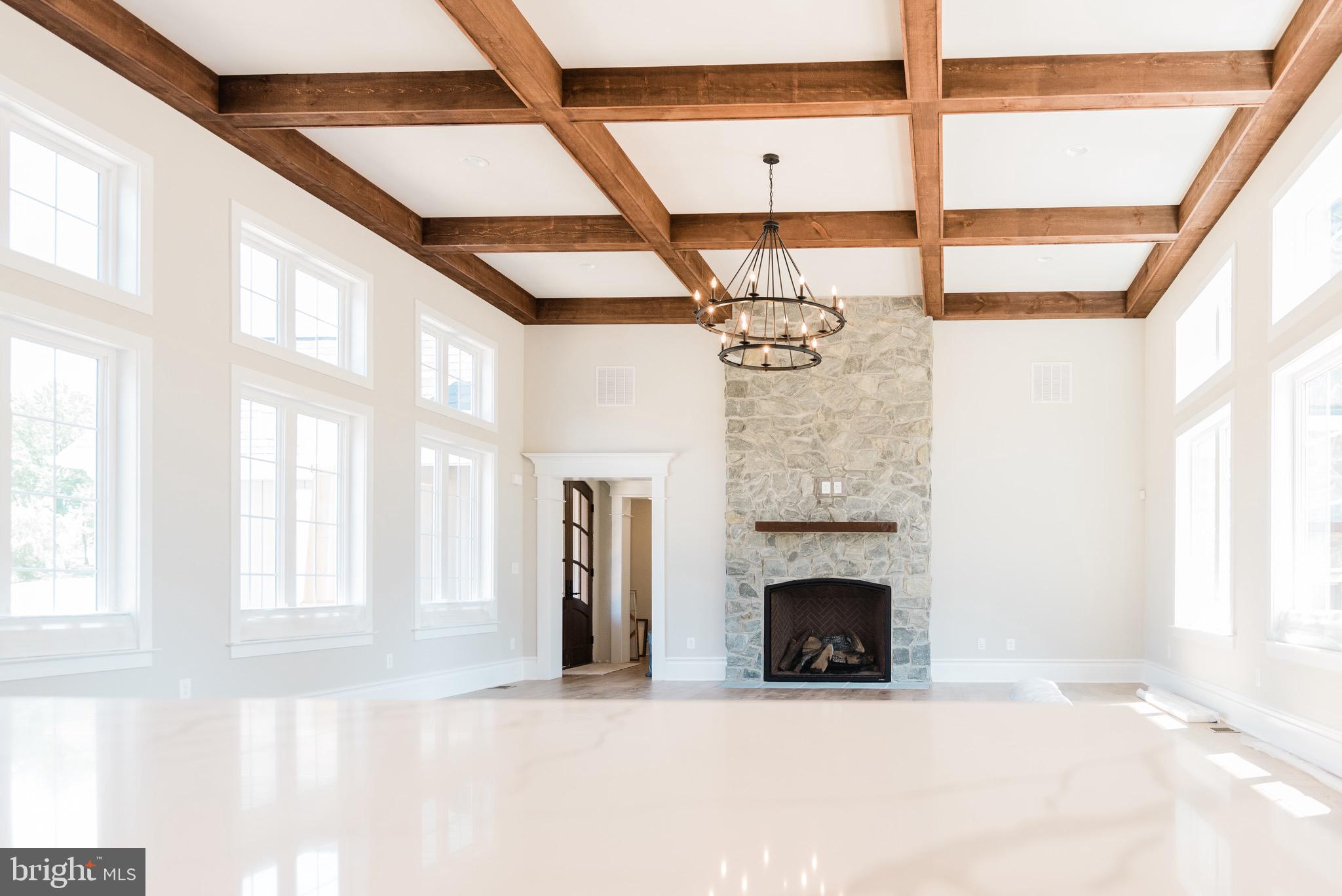 1501 B Peachwood Lane Hunt Valley, MD 21030 - Photo 6 of 11 a view of an empty room with a fireplace and a window