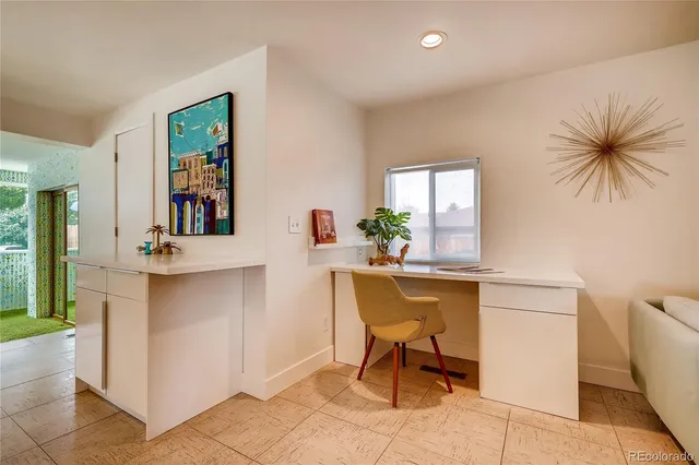 a workspace with furniture and window