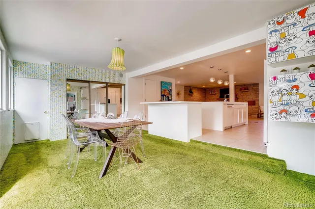 a view of a dining room with furniture and a wooden floor