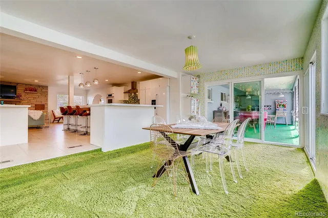 a view of a dining room with furniture and a wooden floor